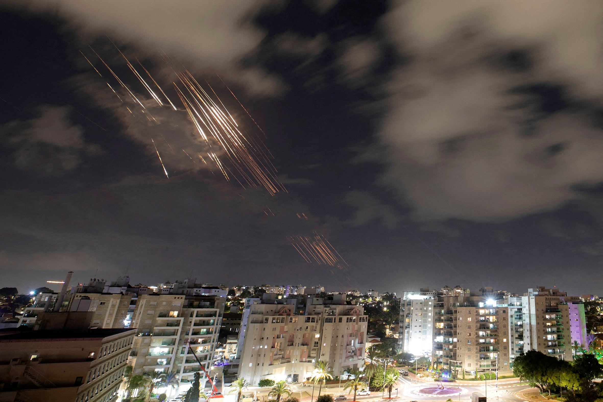 Israel’s Iron Dome anti-missile system intercepts rockets after Iran fired a salvo of ballistic missiles.