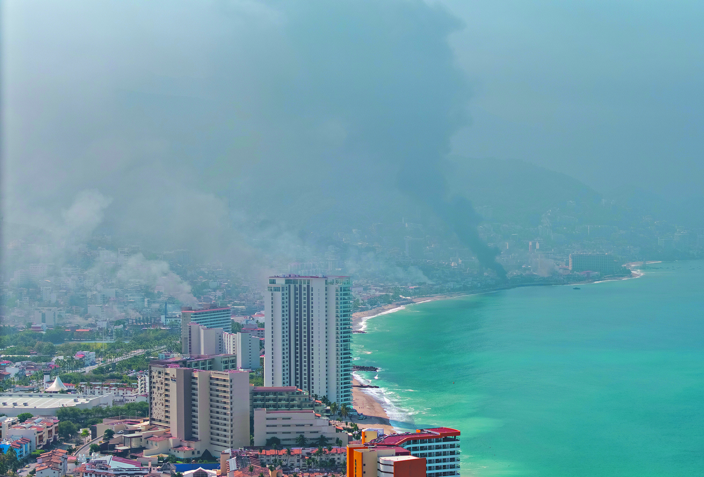 Smoke from torched cars engulfs Puerto Vallarta, Mexico.
