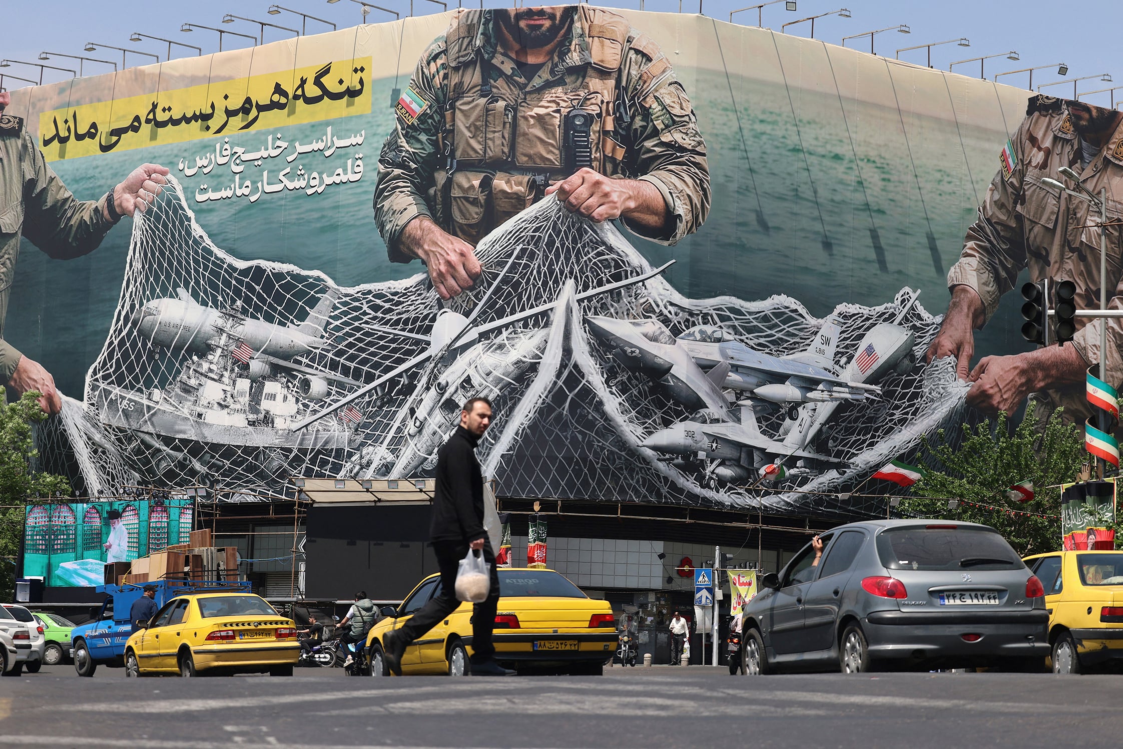A billboard at Tehran’s Revolution Square declares “The Strait of Hormuz remains closed”.