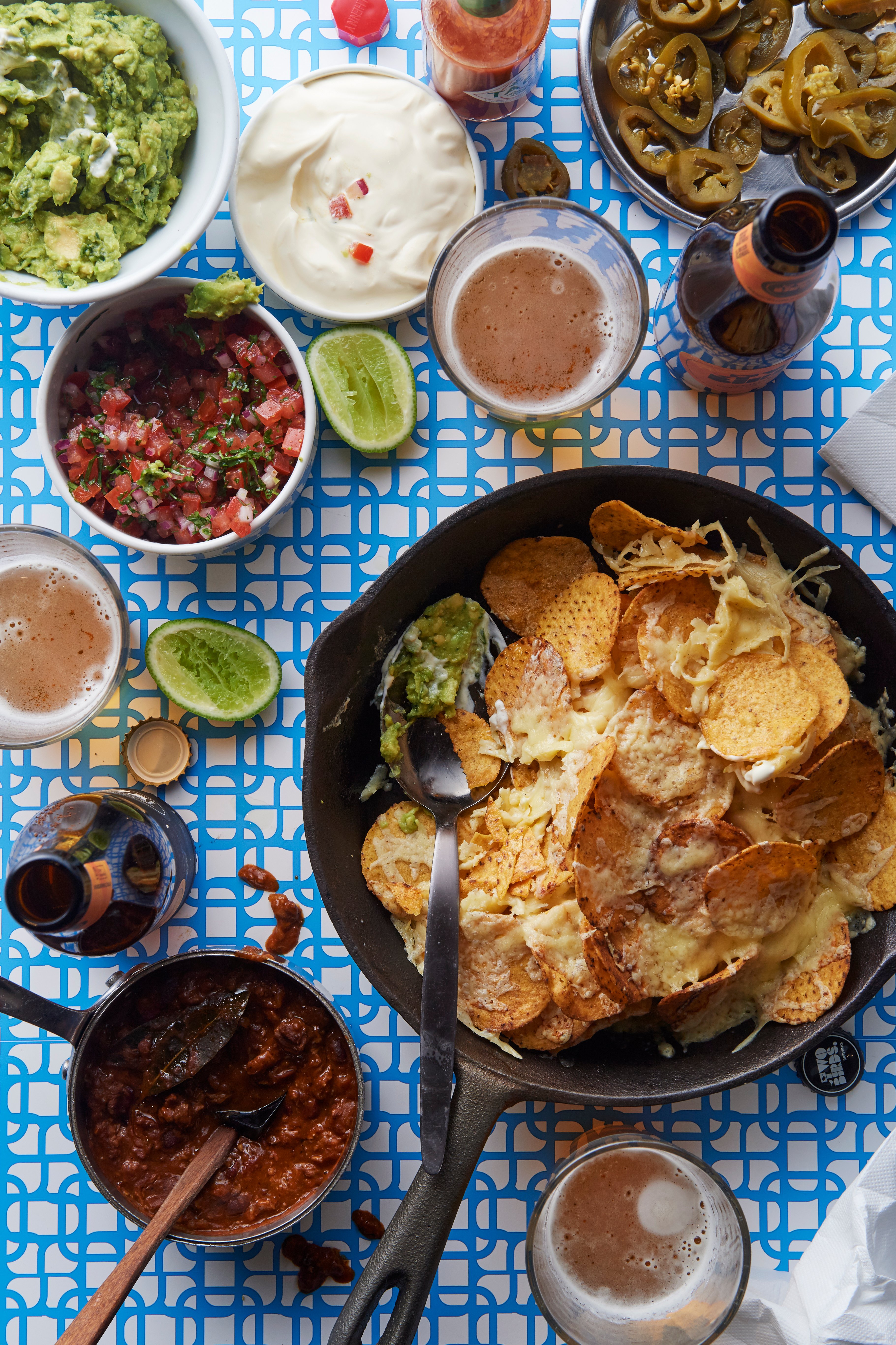 Nachos with guacamole, tomato salsa and chilli con carne
