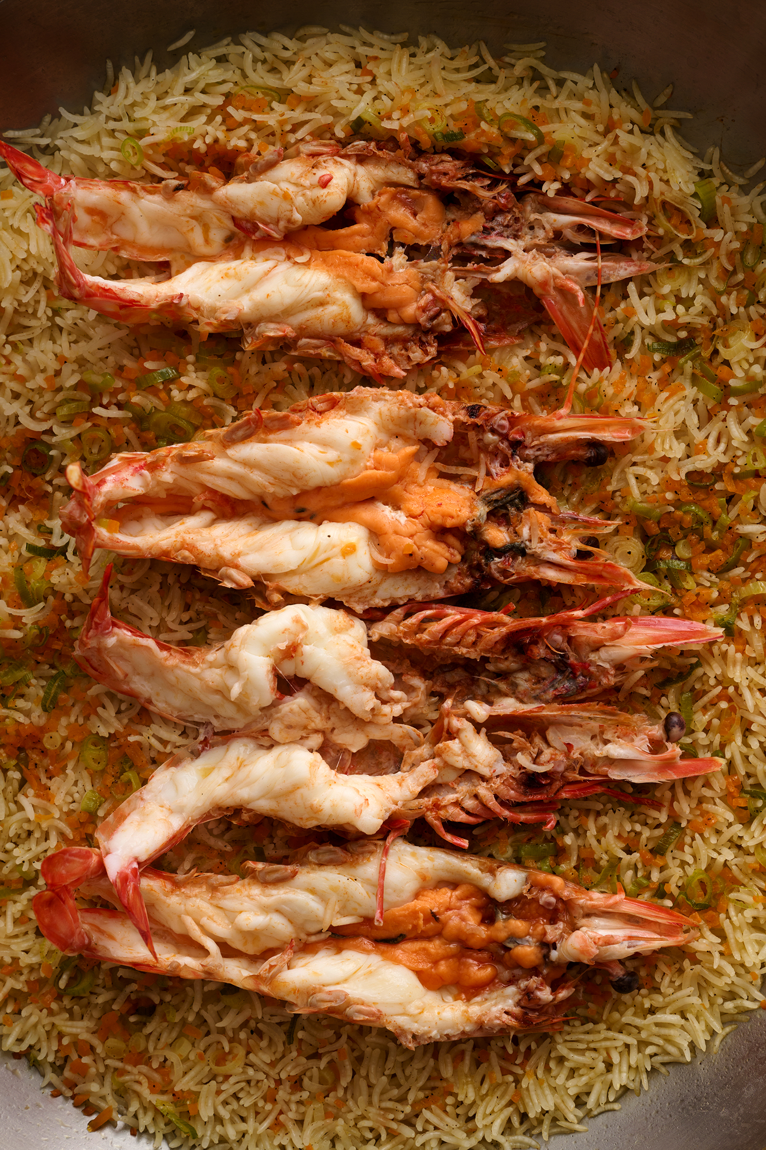 Prawns laid over a bed of rice
