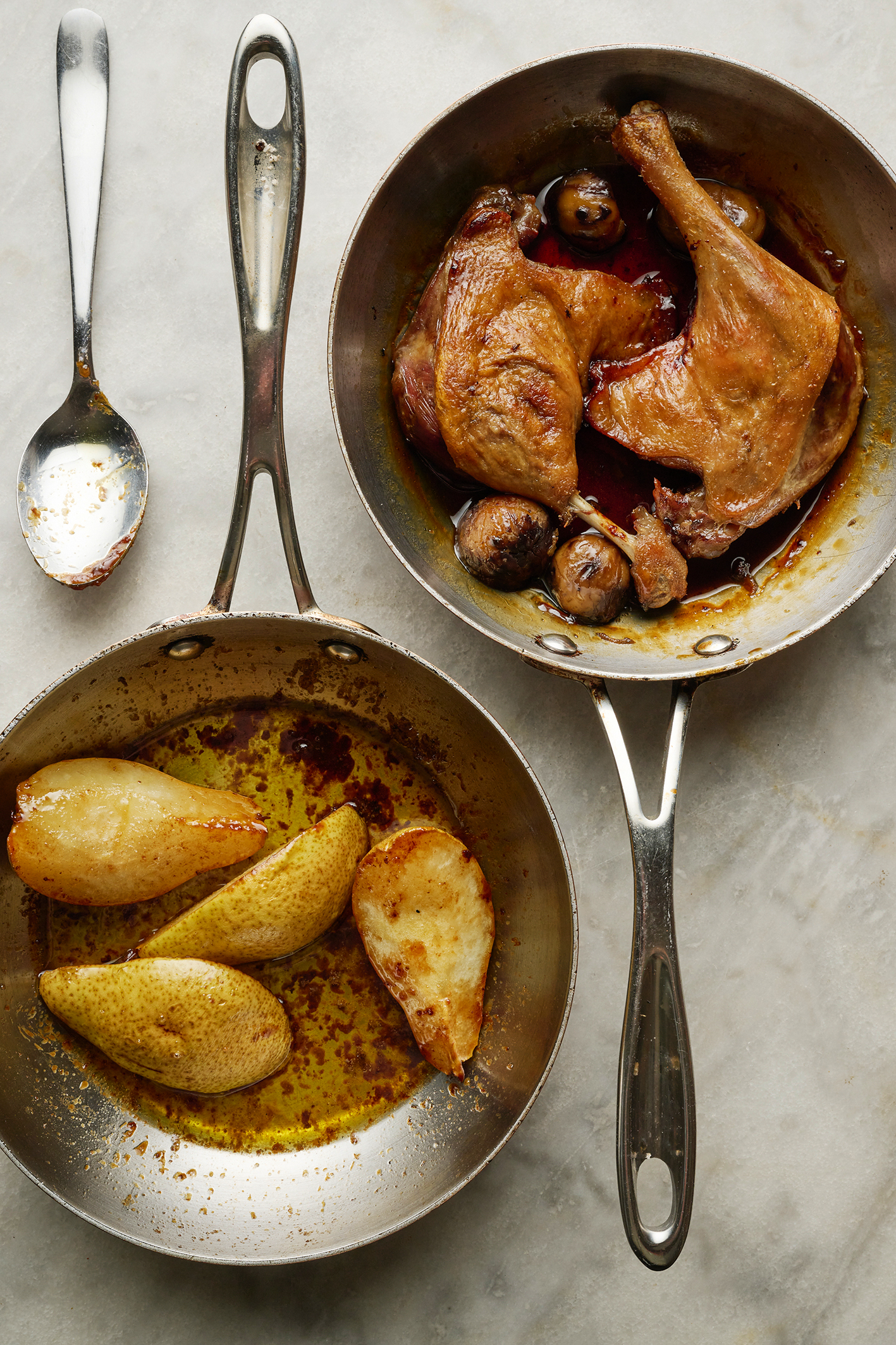 Crispy-skinned duck legs with chestnuts, baked pear and potatoes boulangère