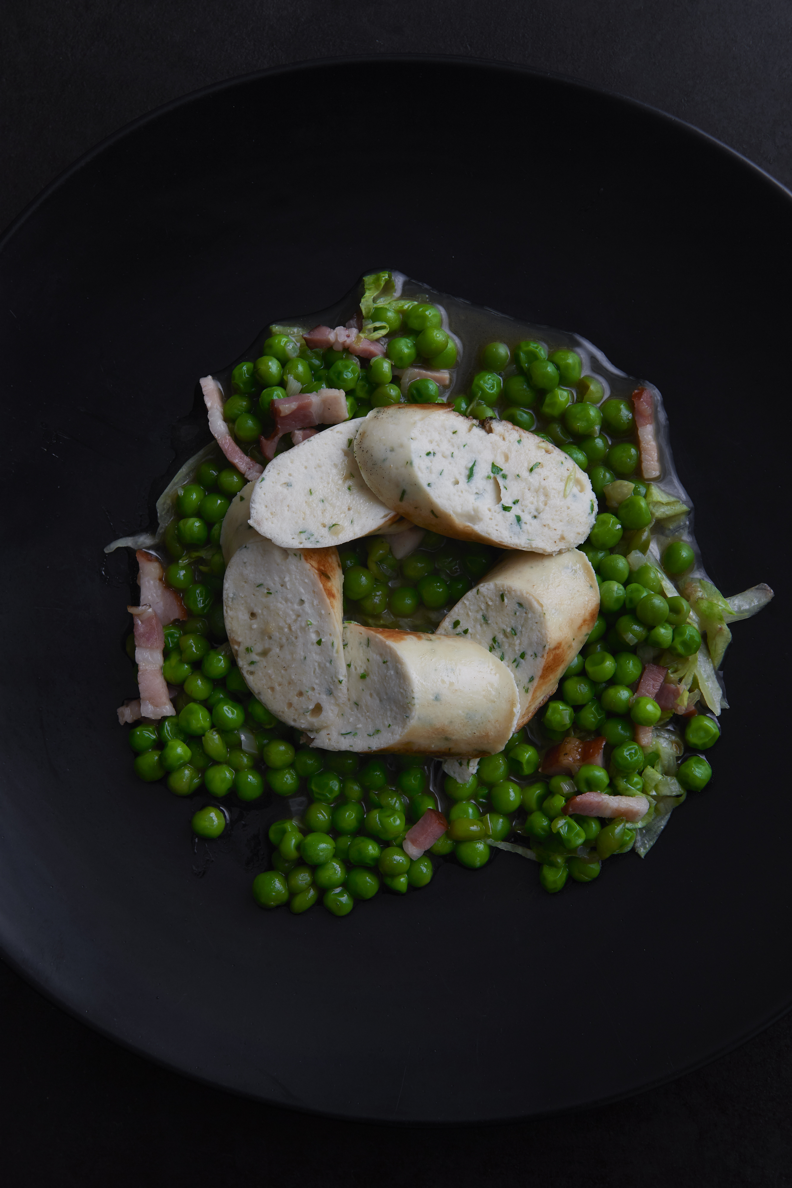 Chicken mousseline sausages with petits pois à la française