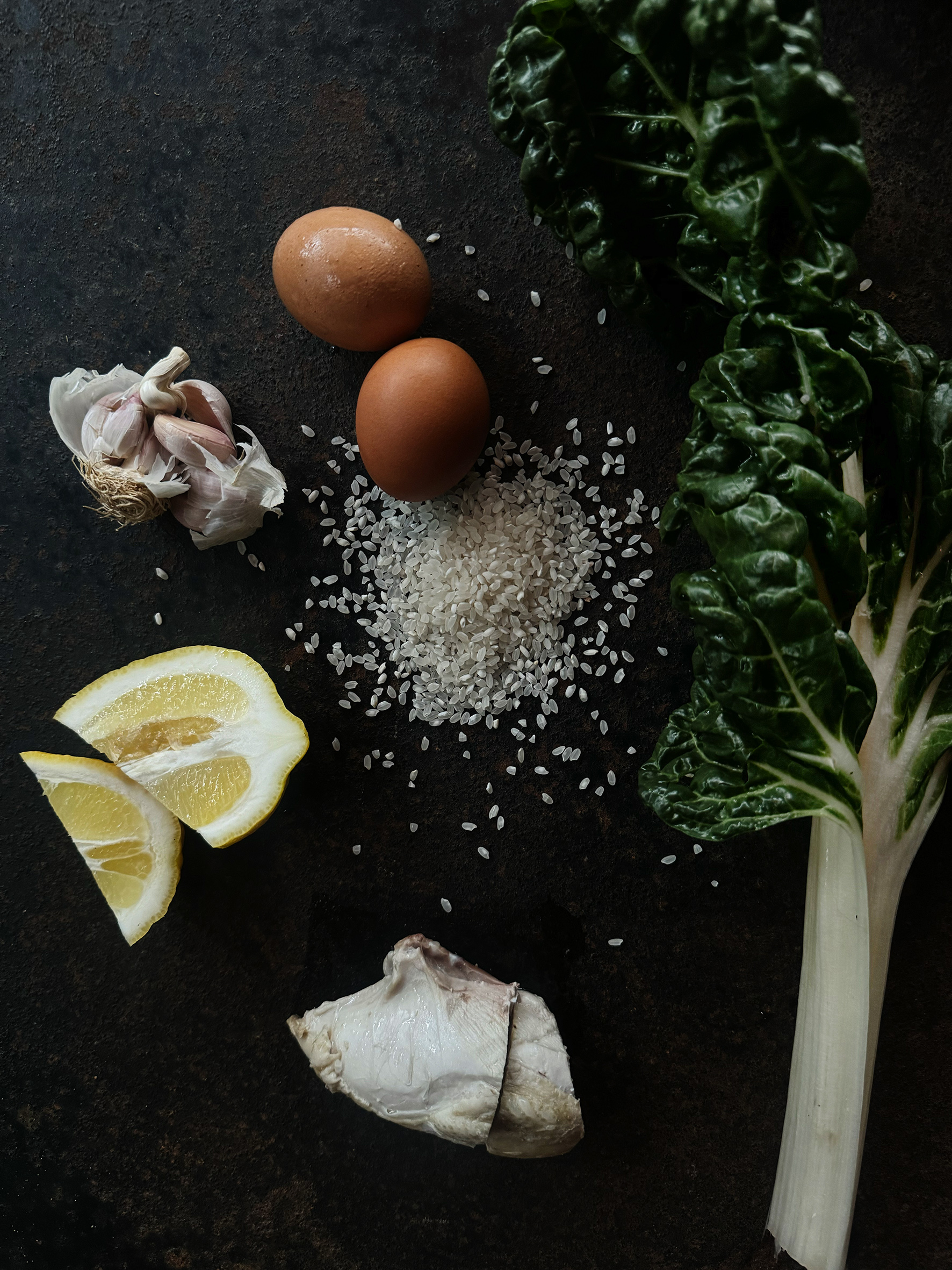 Eggs, lemon, garlic and sat on a table