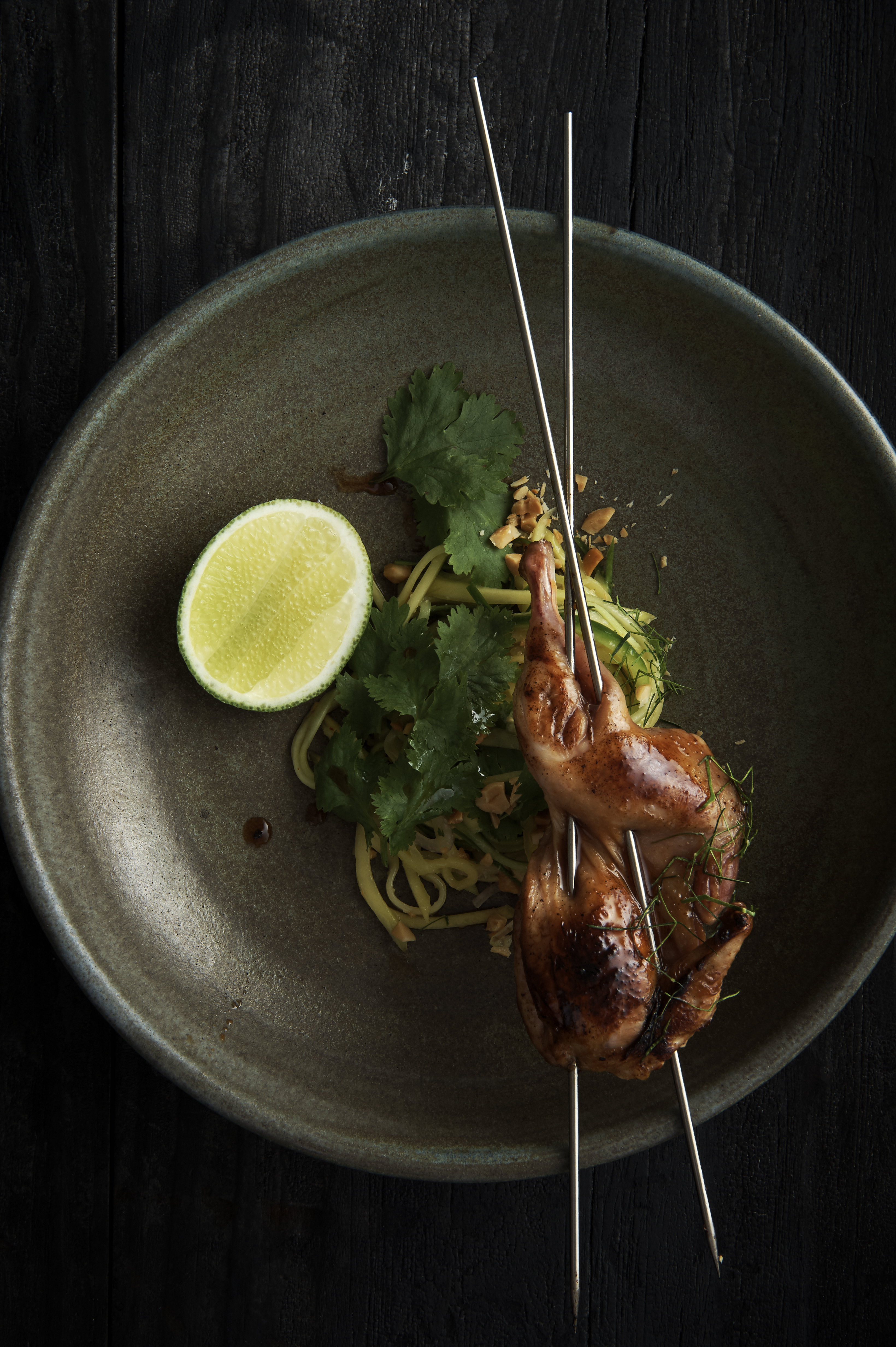 Grilled quail with green mango salad
