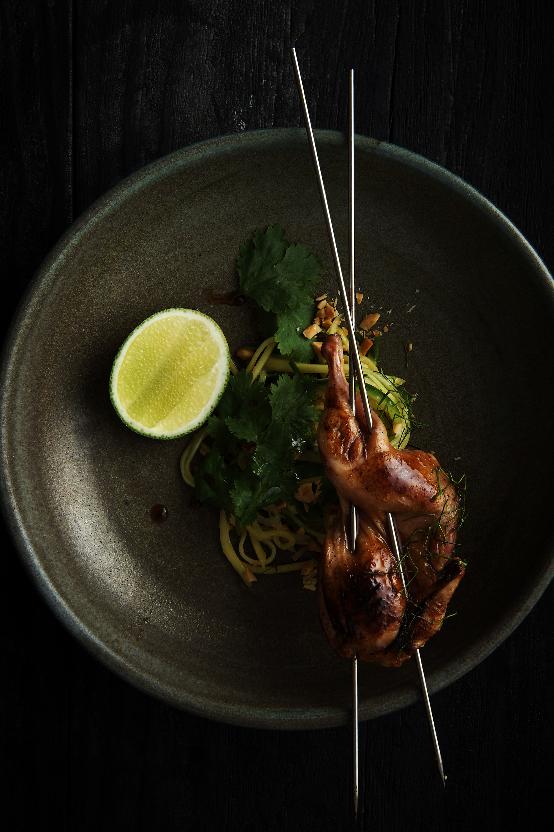Grilled quail with green mango salad