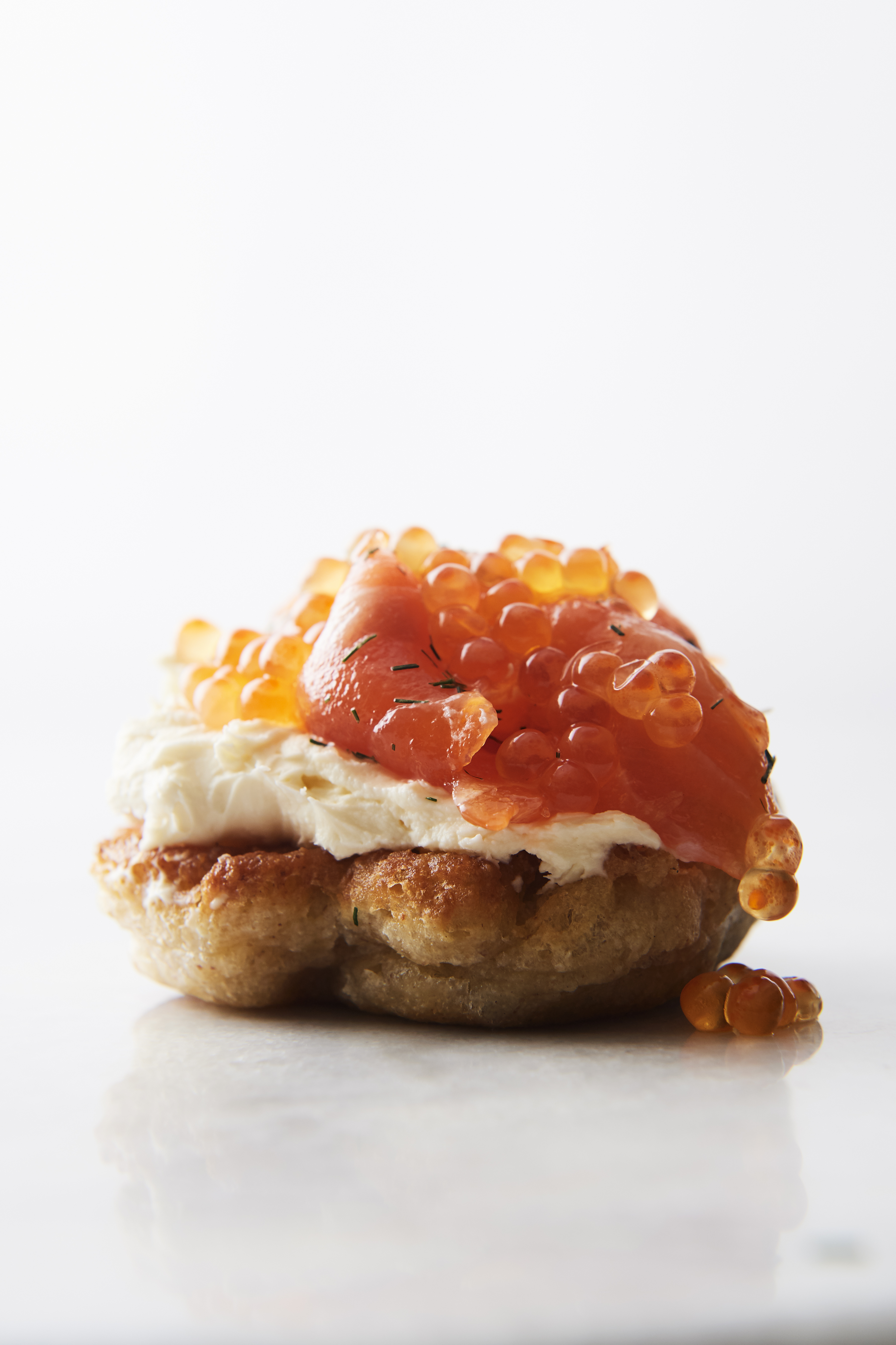 Cured ocean trout on a buckwheat blini with crème fraîche and salmon roe