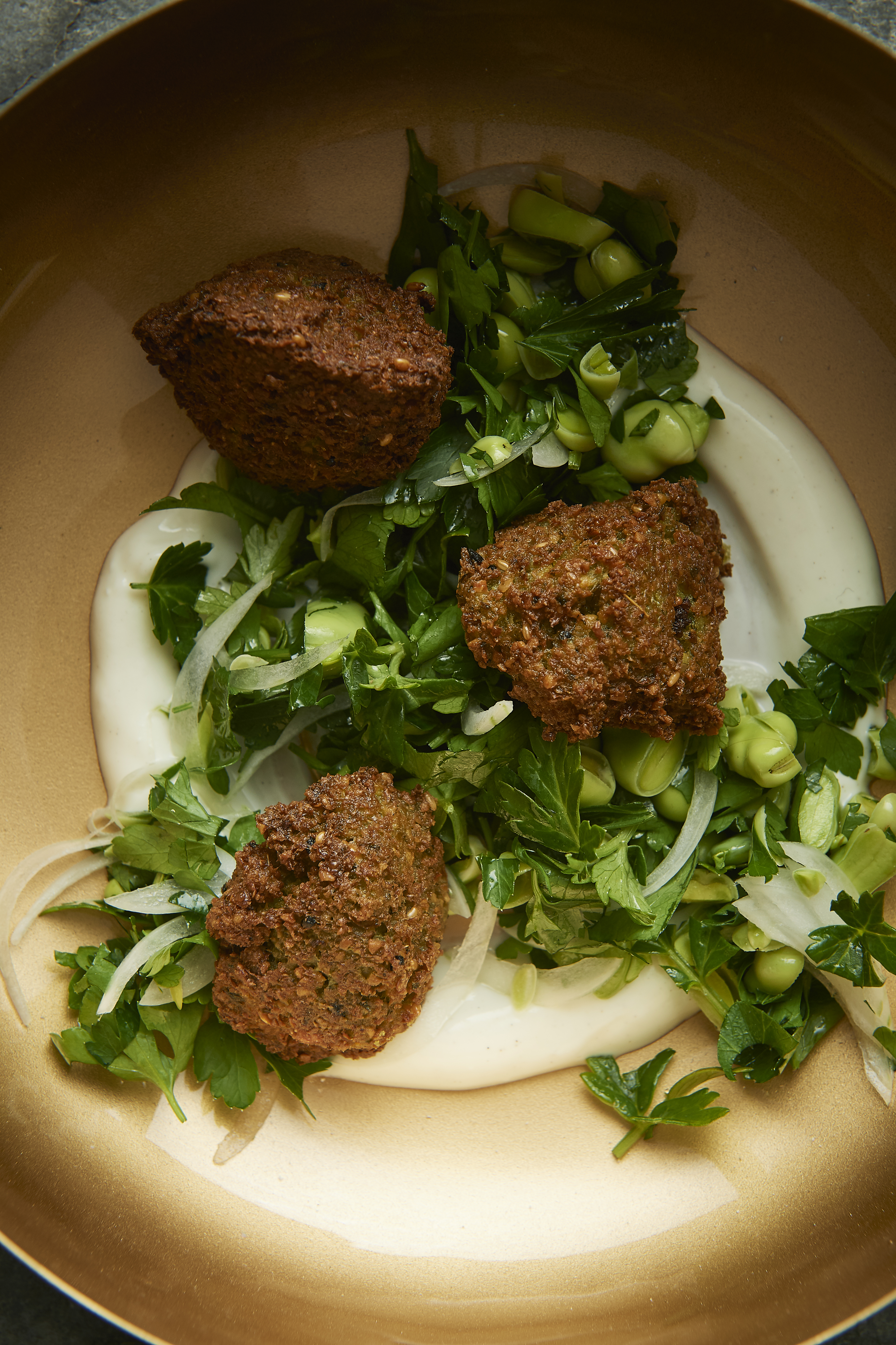 Broad bean falafel with tahini dressing and salad
