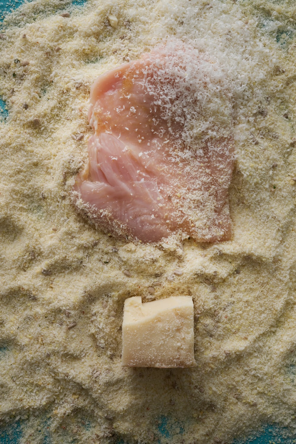 Chicken schnitzel with seed and parmesan crumb and white slaw