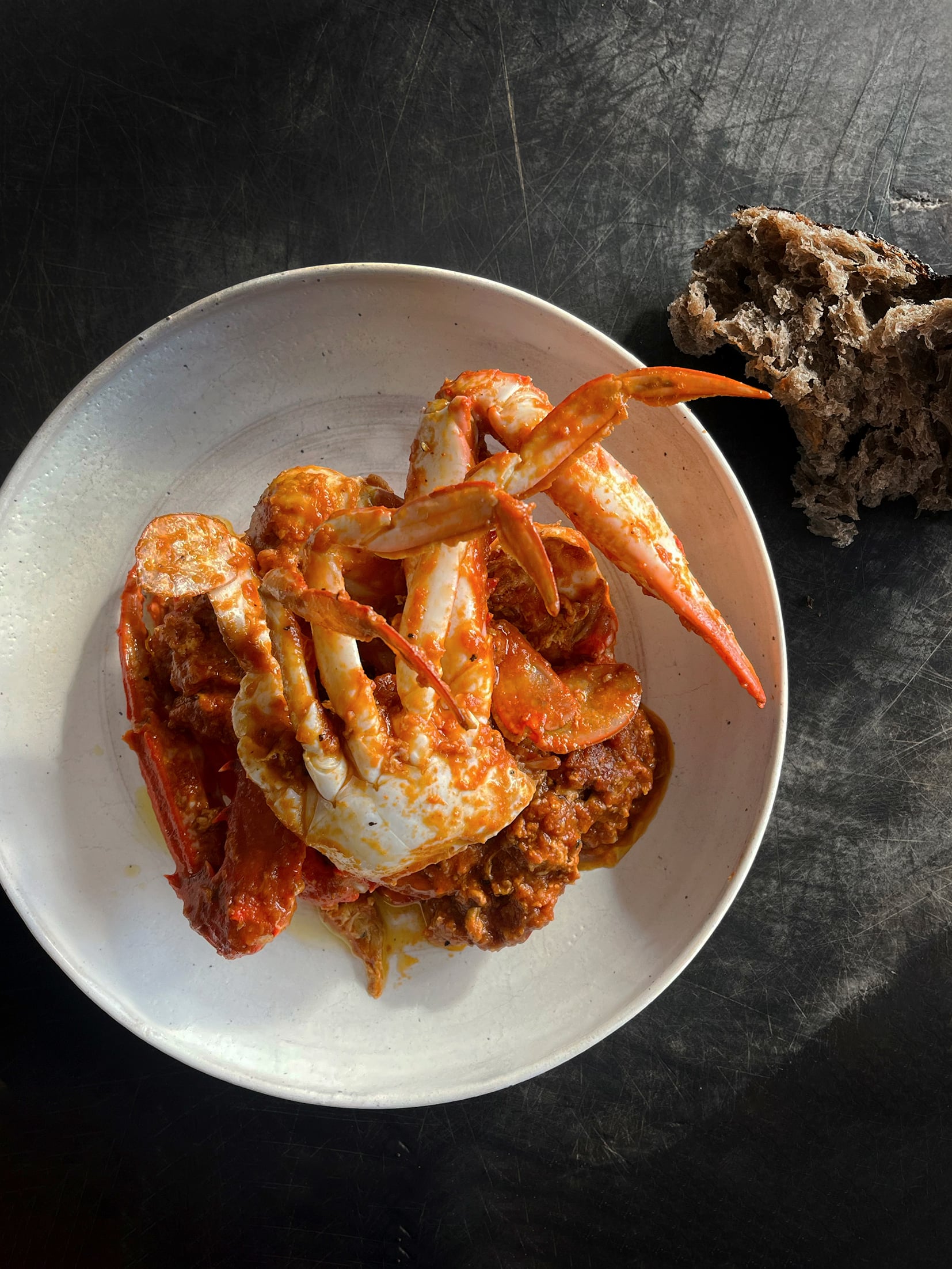 Cooked crab in a ceramic bowl.