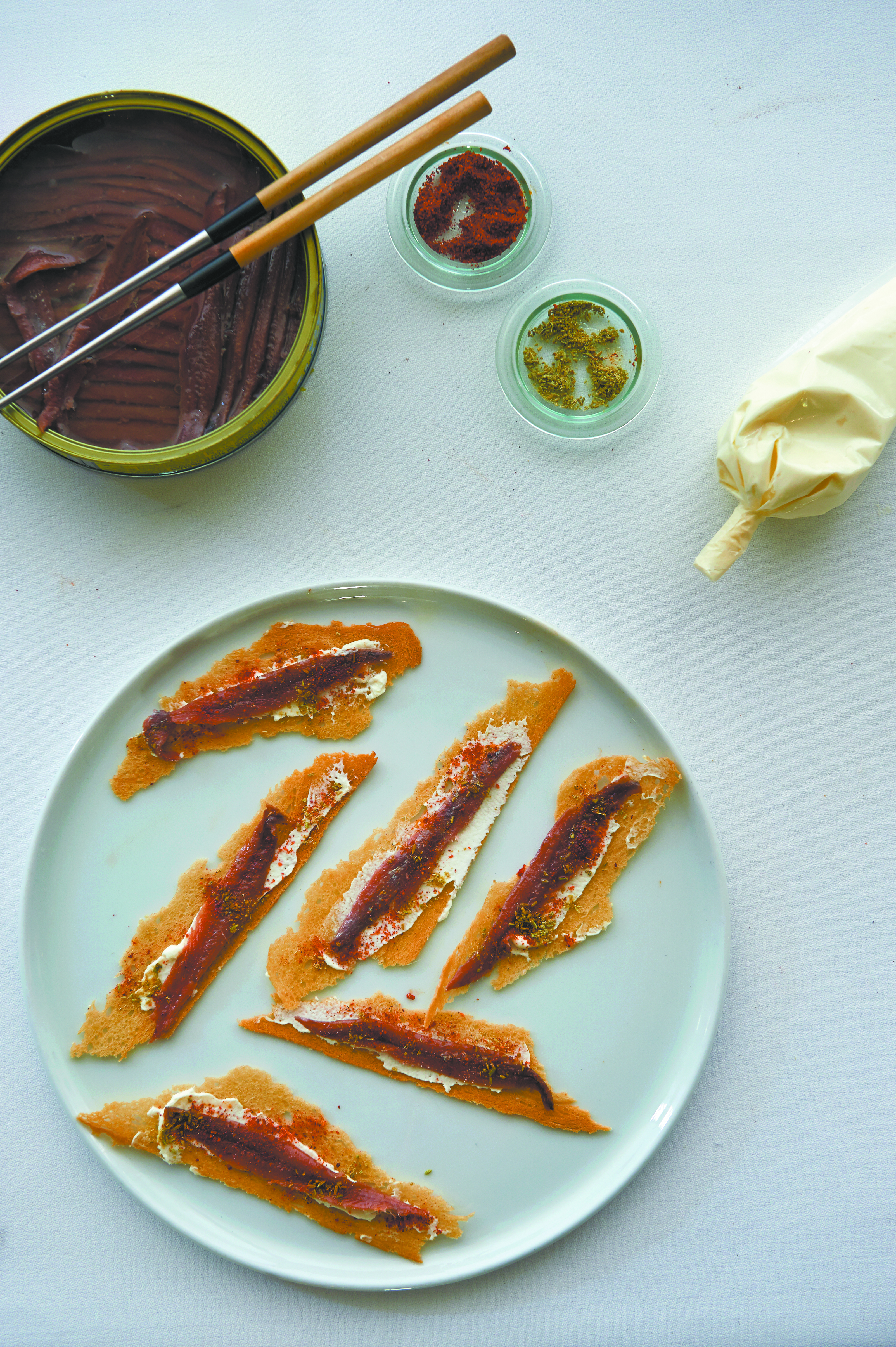 Anchovy, garlic and celery salad and anchovies on toast