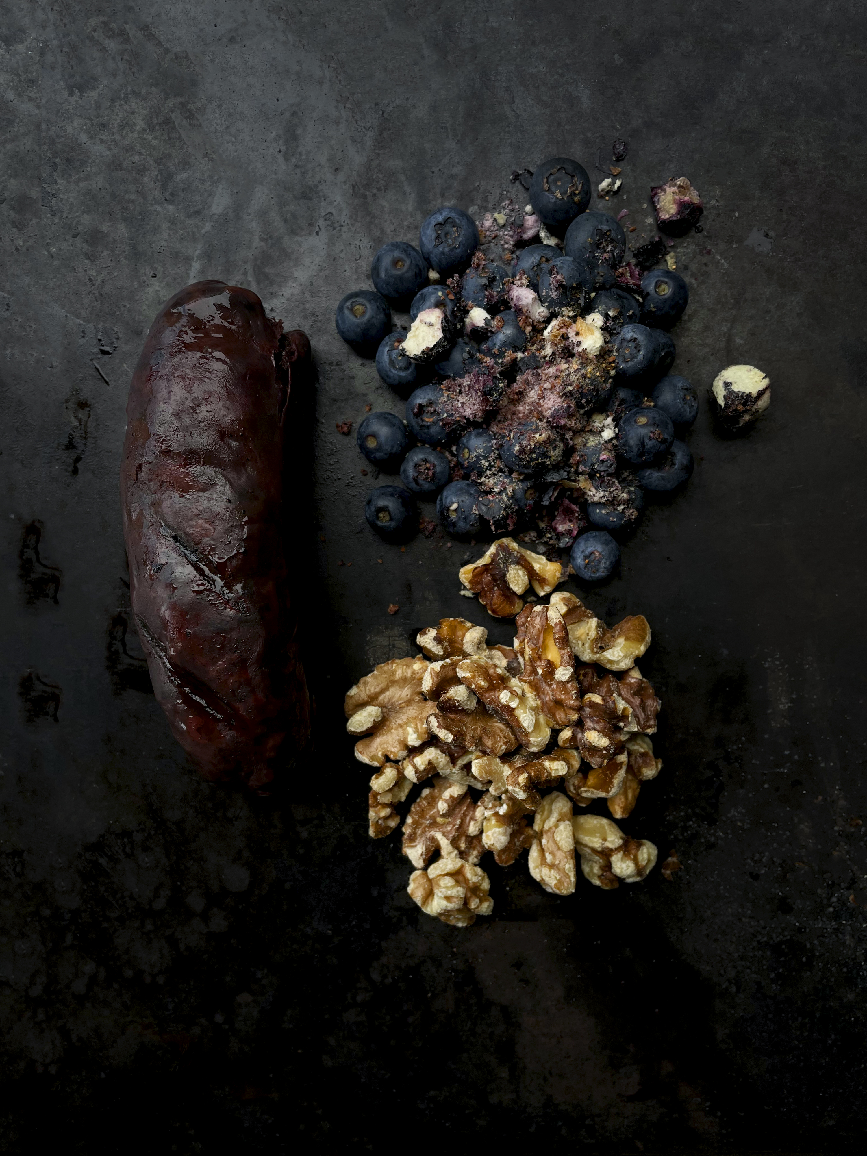 Radicchio, walnut tarator, blueberries and roasted blood sausage