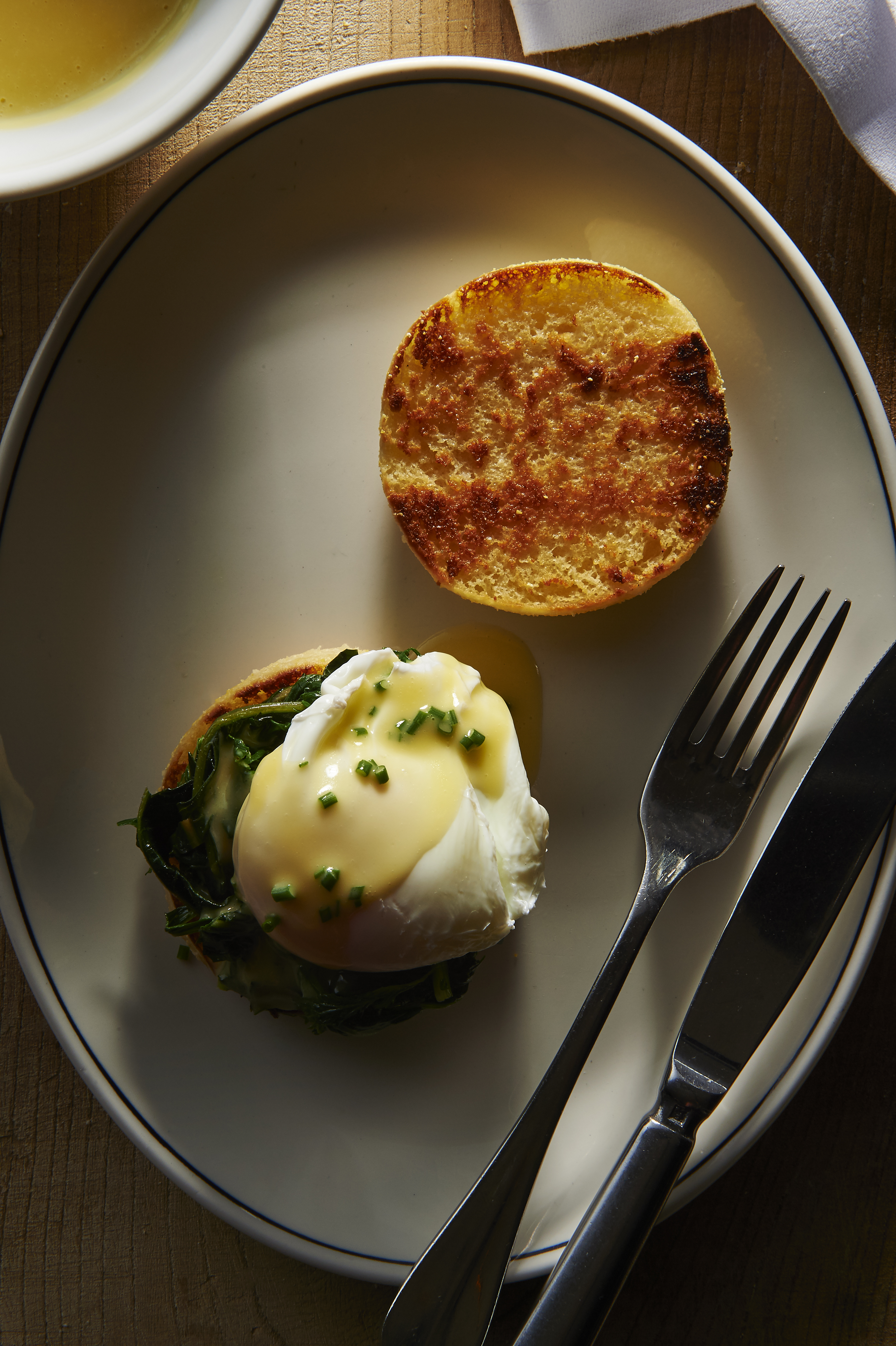 English muffins with poached eggs, sautéed spinach and lemon butter sauce
