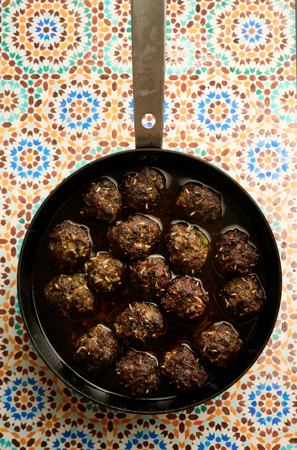 Egyptian herbed beef kofta braised  in tomato sauce