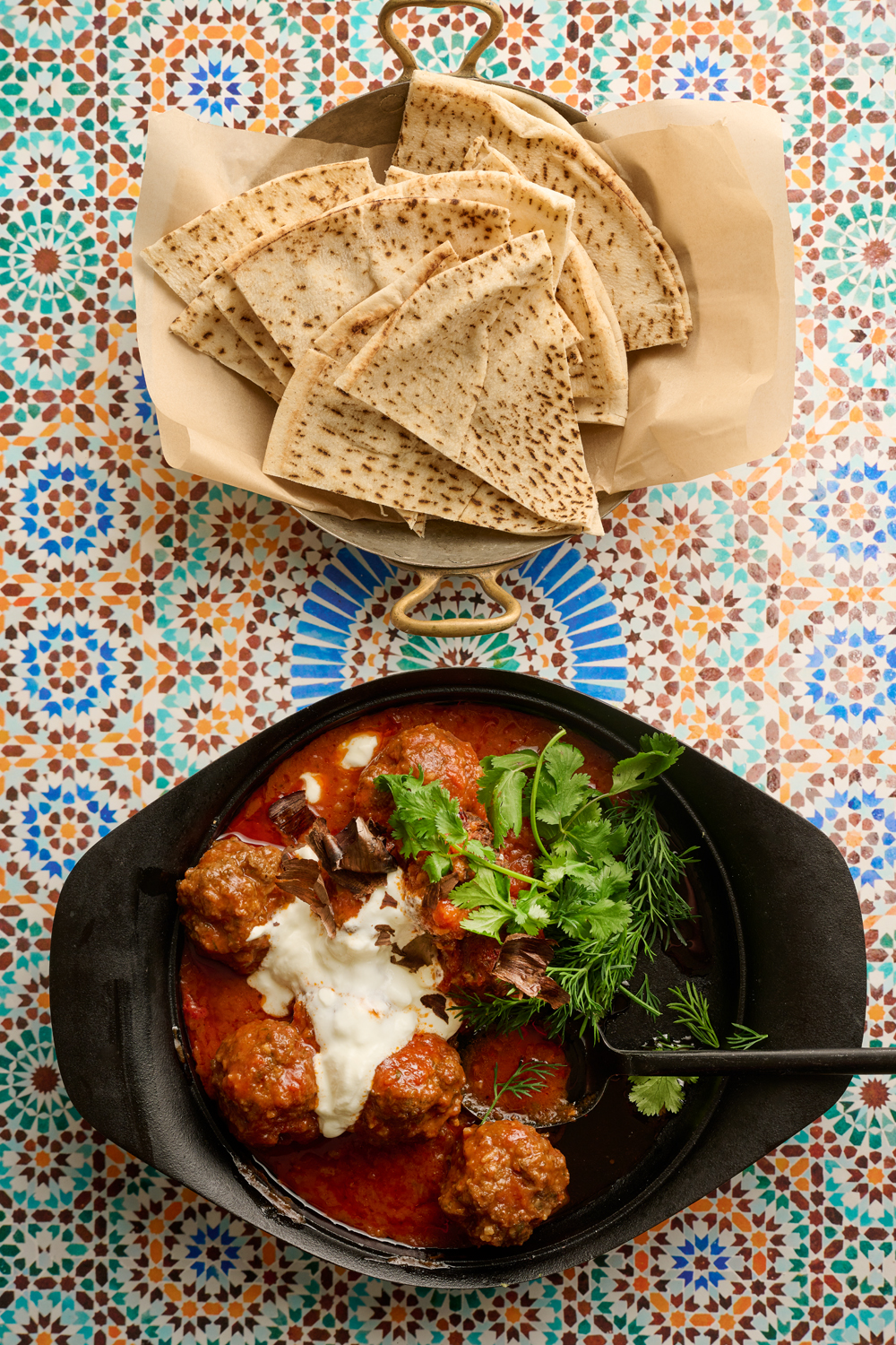 Egyptian herbed beef kofta braised  in tomato sauce