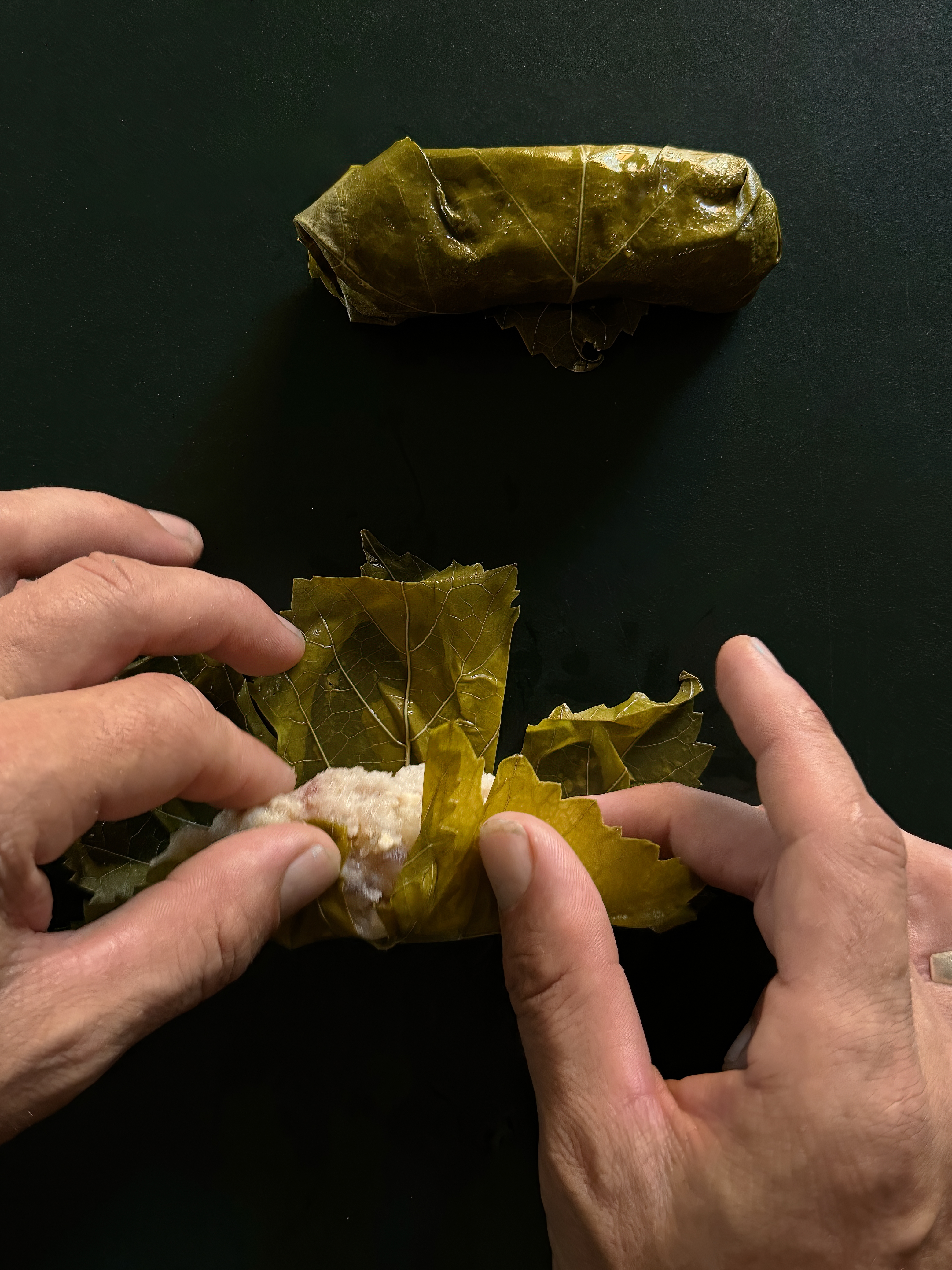 Vine leaf dumpling salad with bitter leaves, honey and thyme