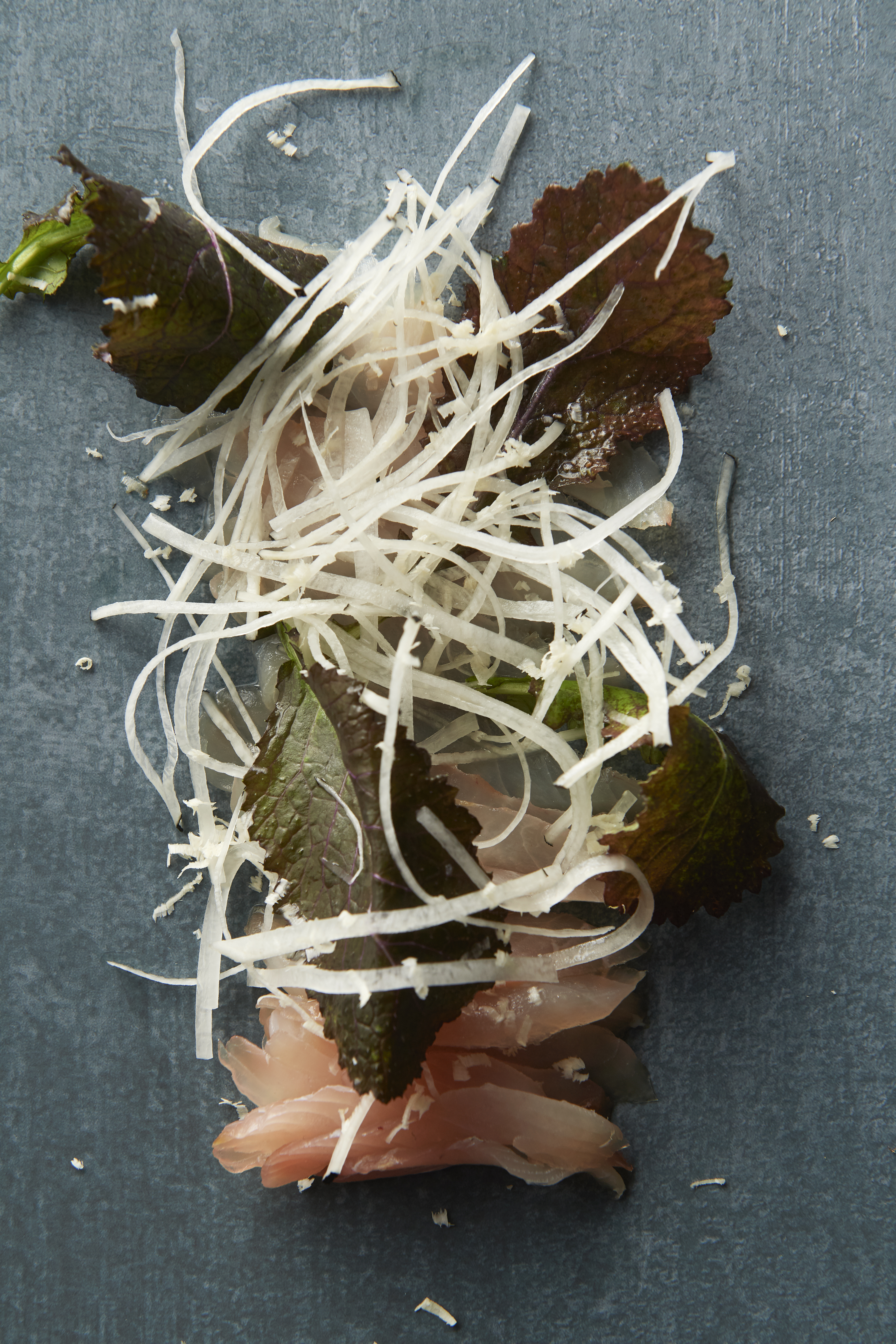 Radishes with raw silver trevally and sweet sesame