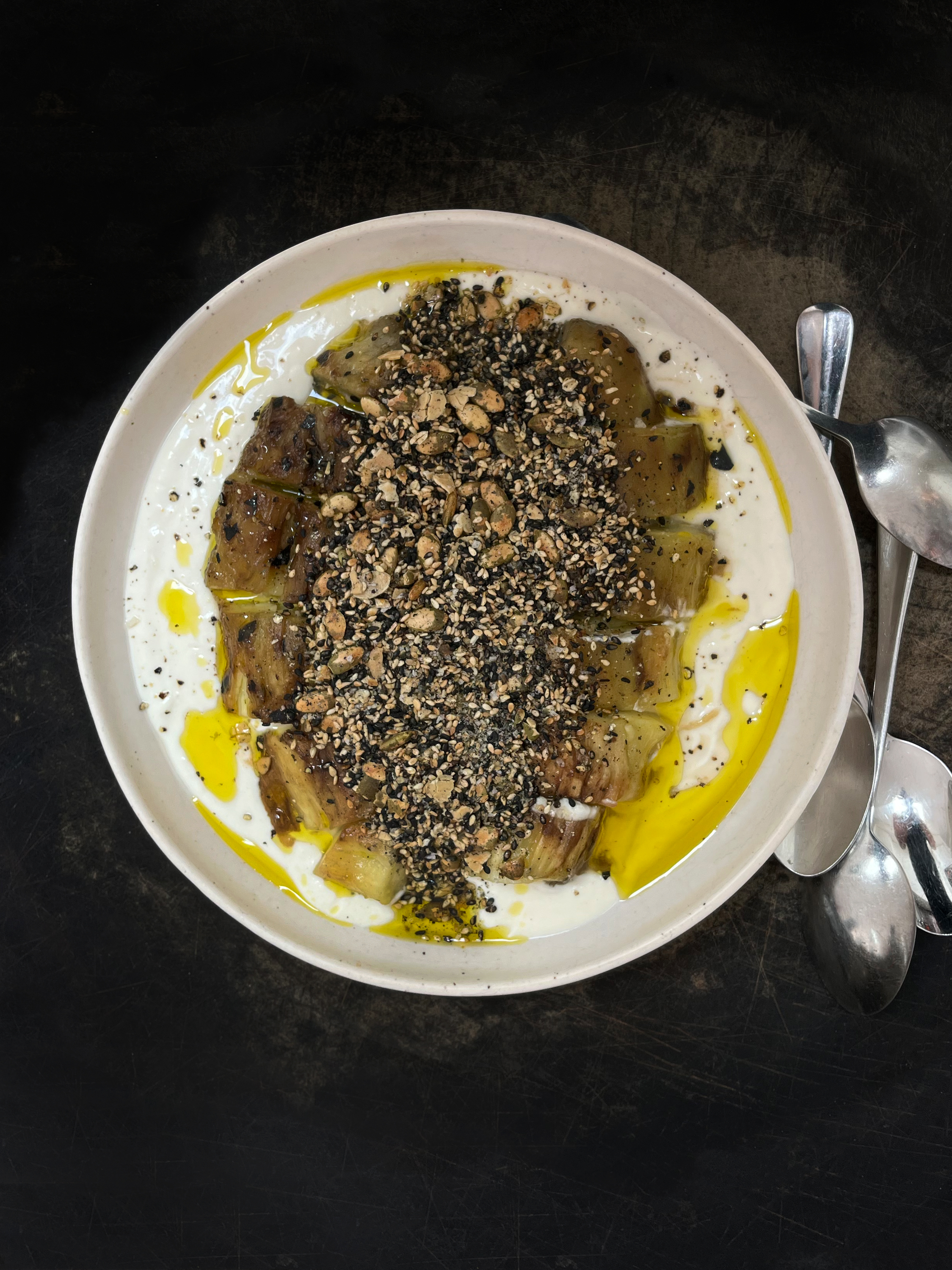Smoky eggplant with yoghurt, tahini and seeds