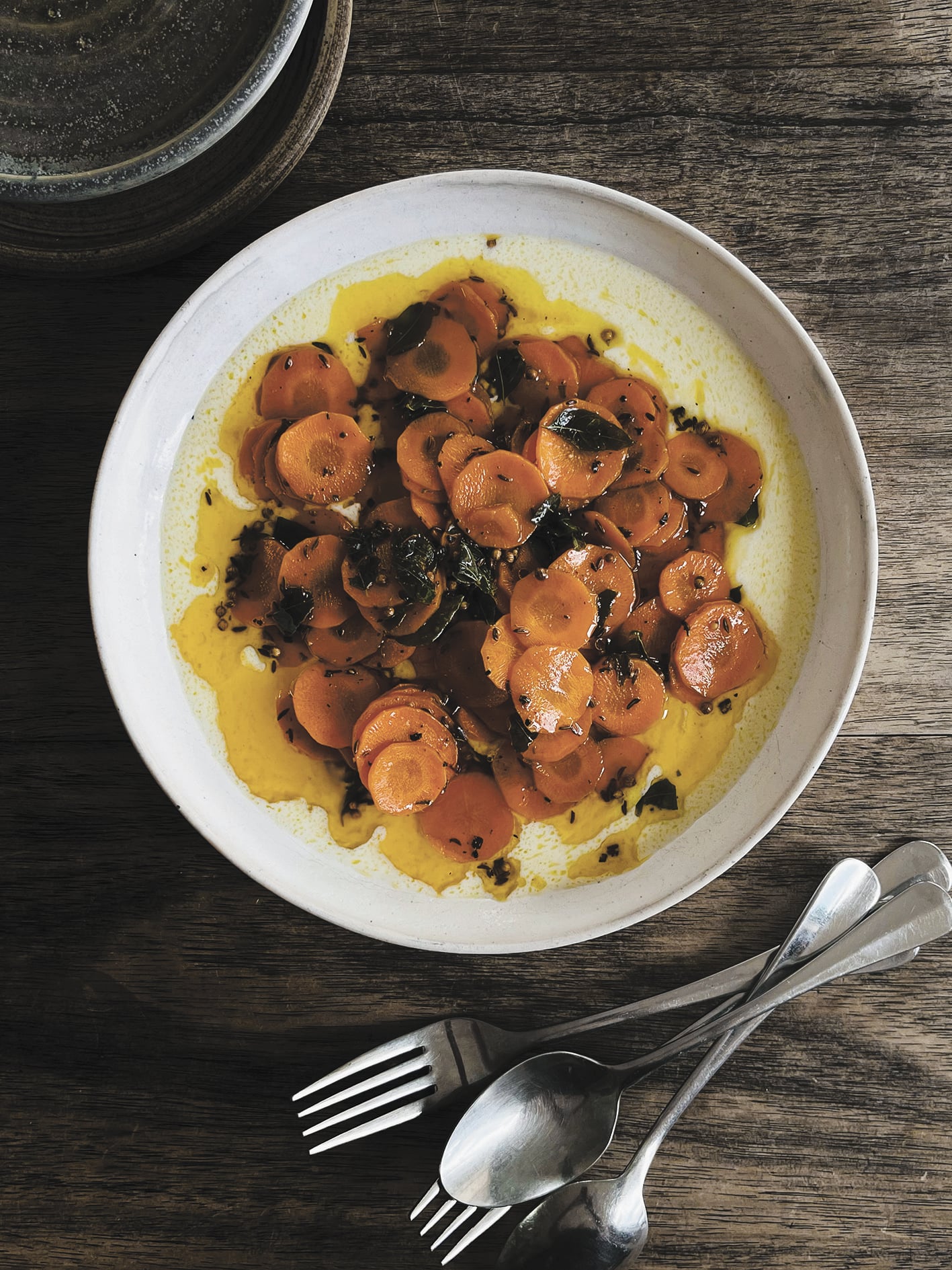 Buttered carrots with curry leaves, spices and sour yoghurt