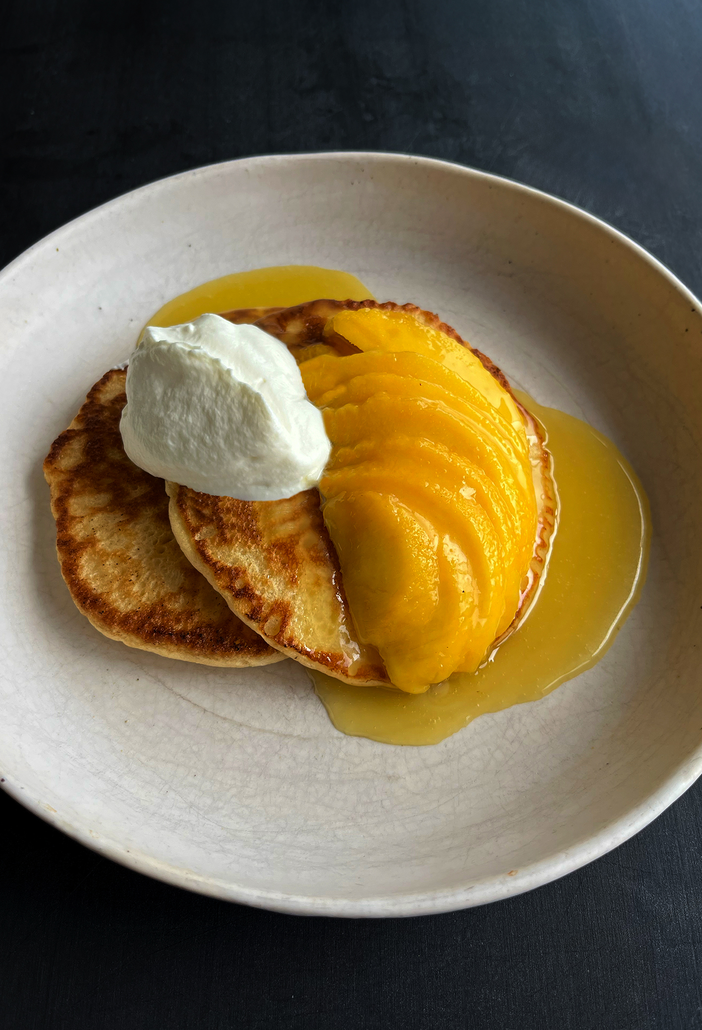 Fluffy pancakes with mango butterscotch sauce