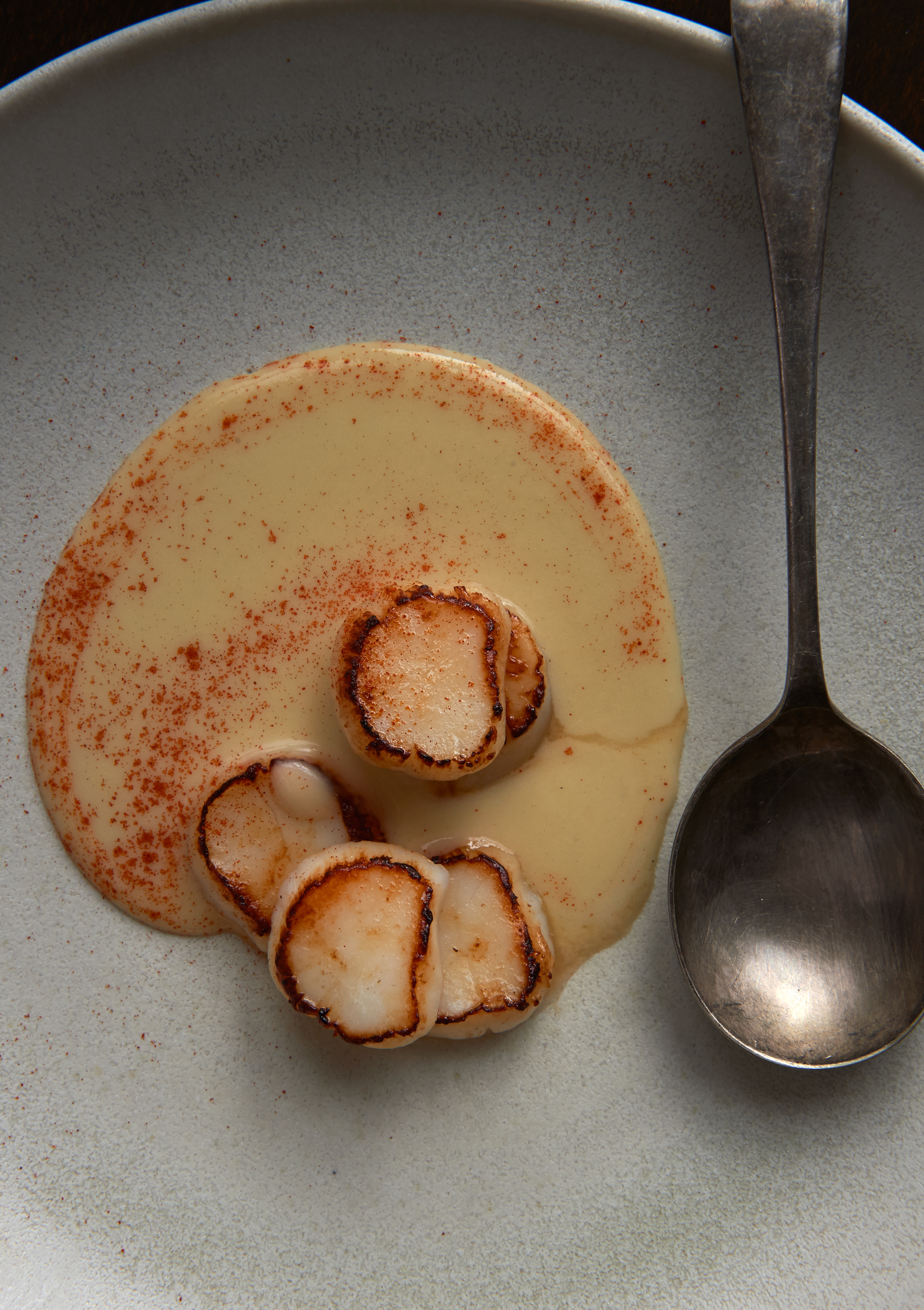 Garlic and potato soup with scallops