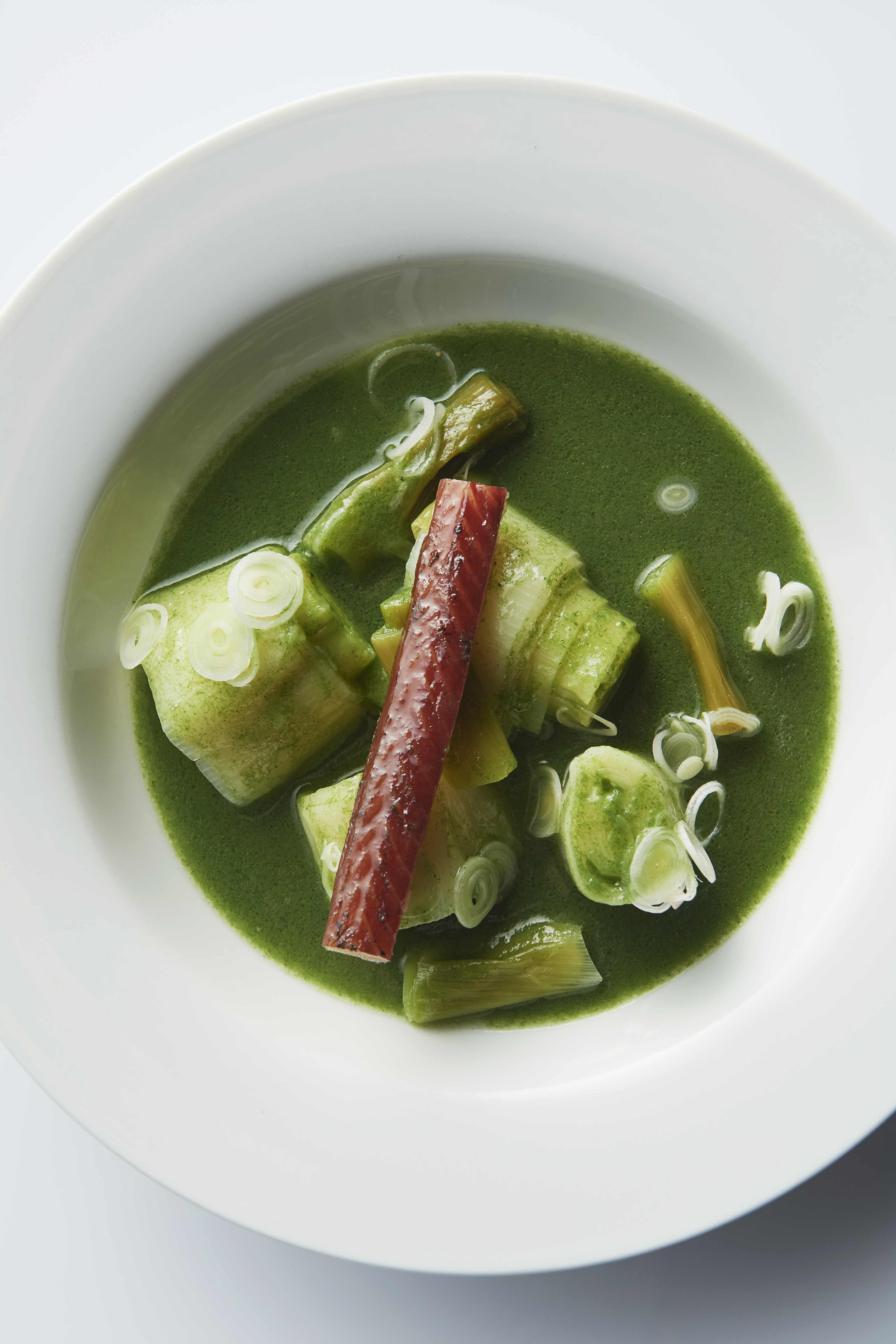 Spring onion and leek broth with smoked eel