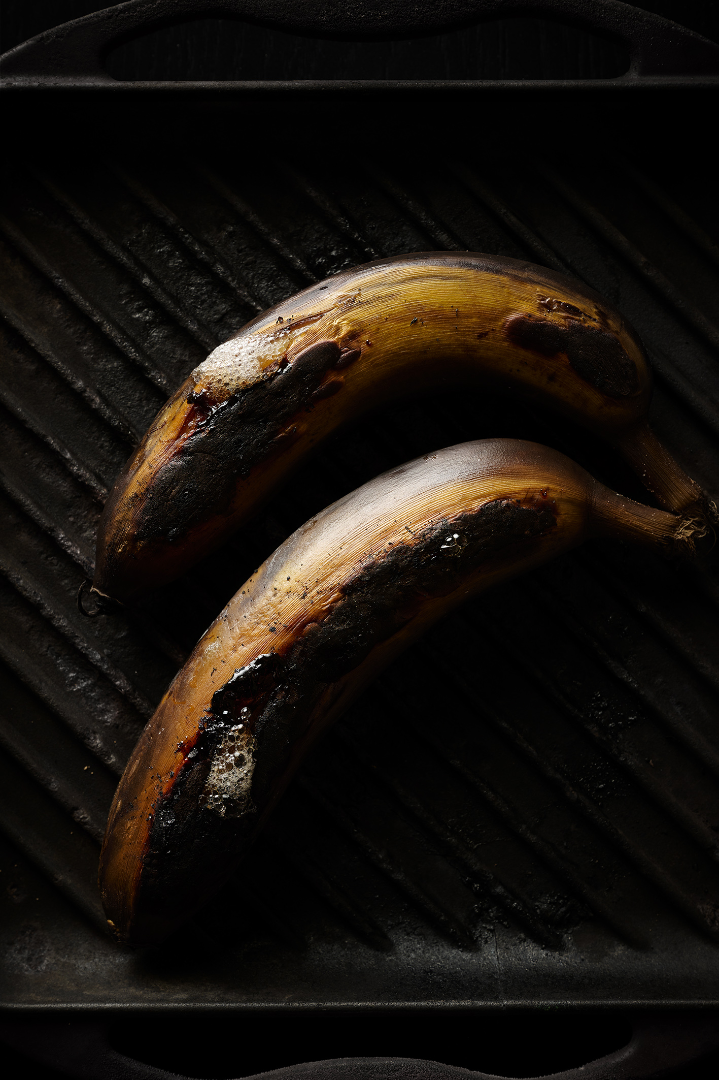 Grilled bananas with salted caramel sauce, vanilla ice-cream and peanuts