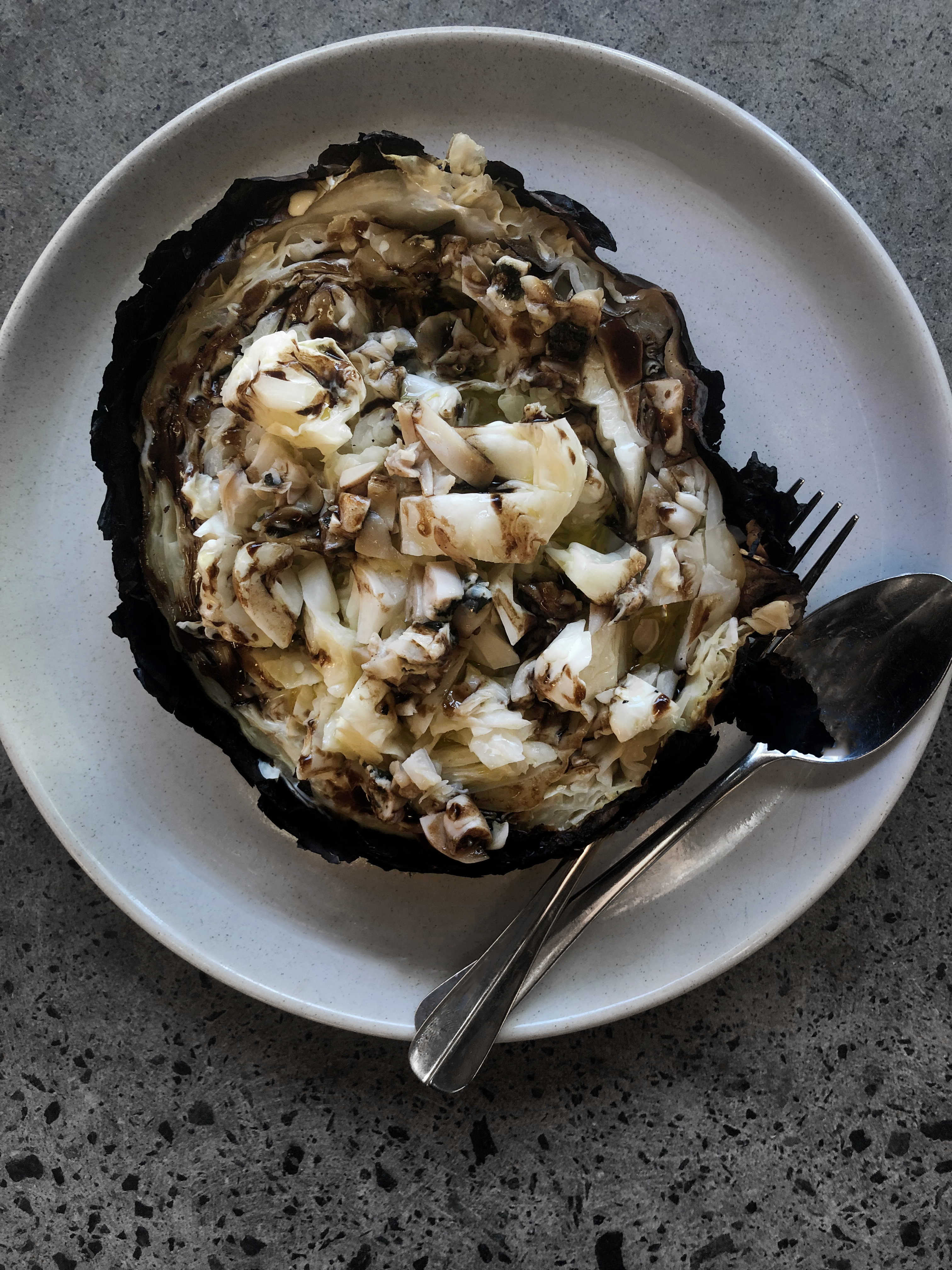 Whole roasted cabbage with smoked pipis and garlic cream