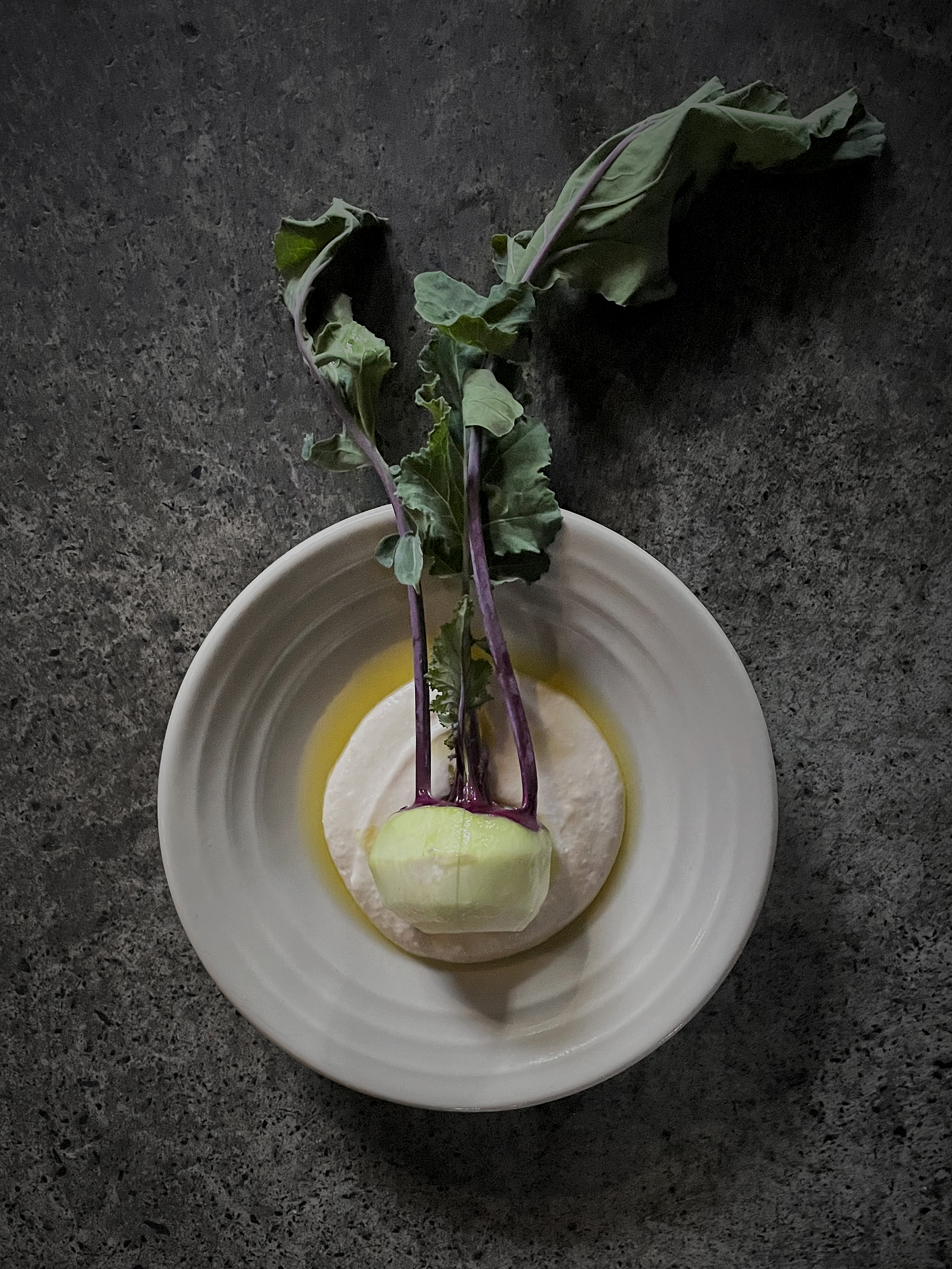 Roasted kohlrabi with lamb and prune sauce, and raw kohlrabi with macadamia cream