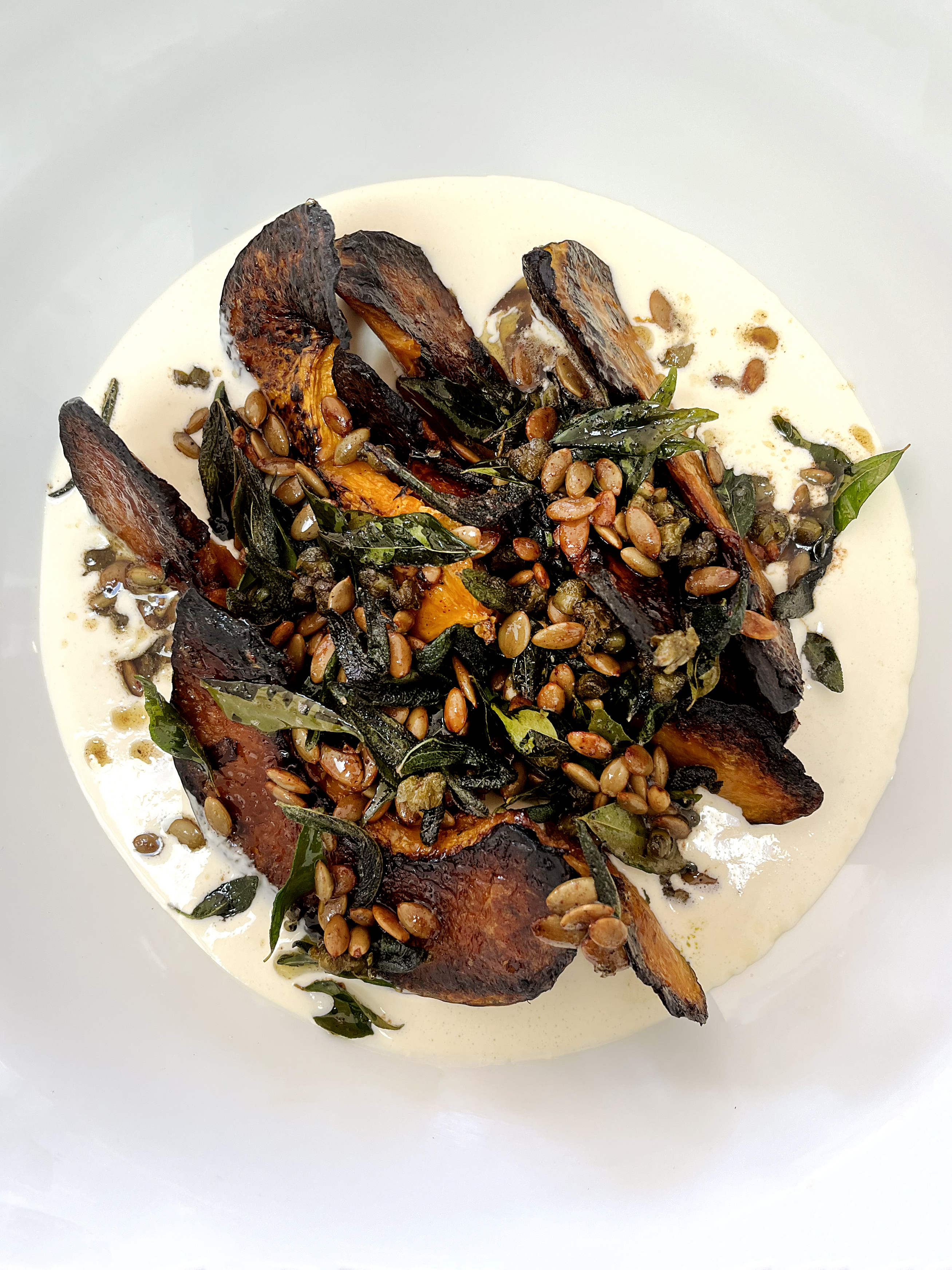 Roasted pumpkin with taleggio cream, sage and curry leaves 