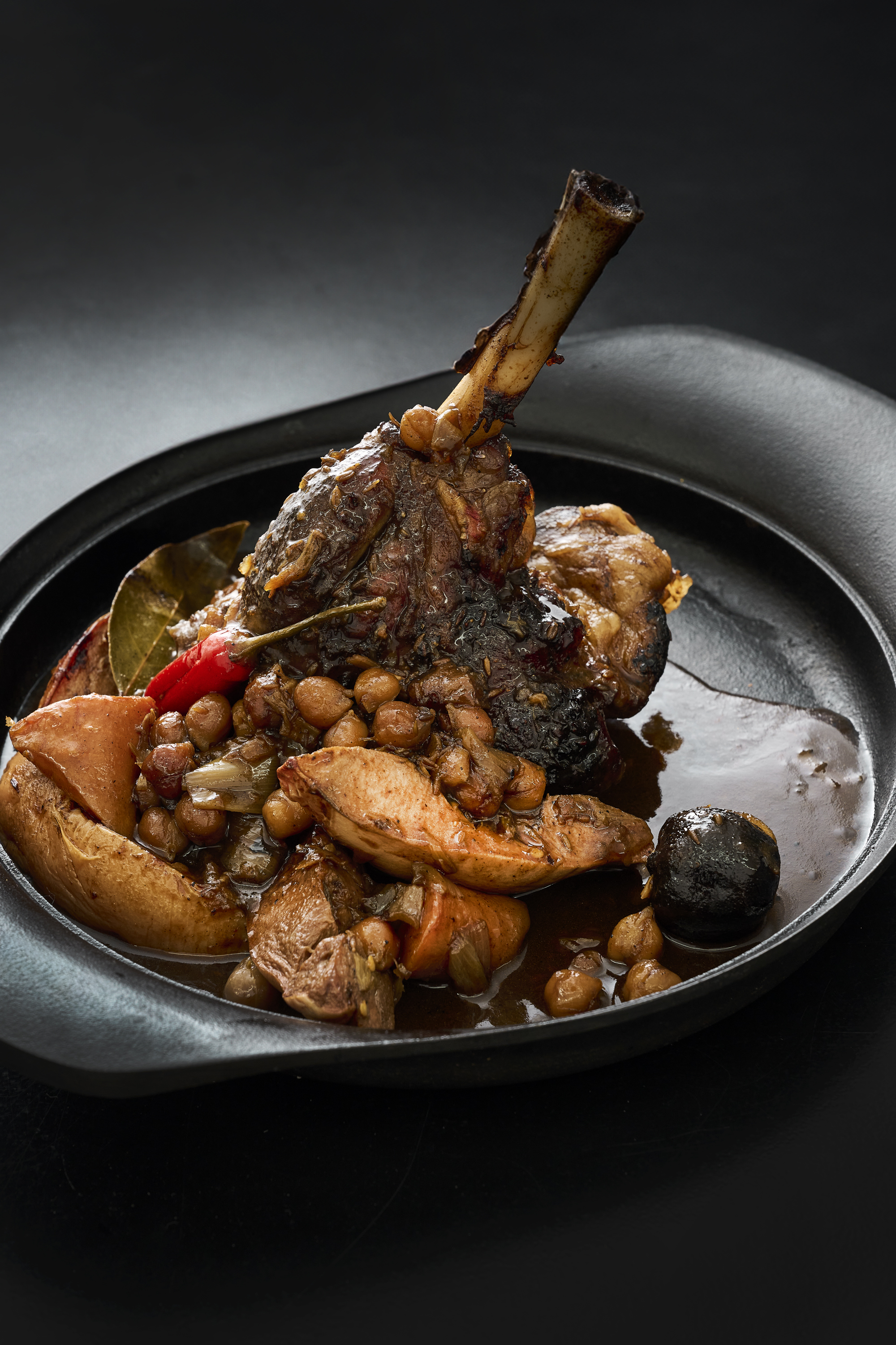 Spiced lamb shanks with quince, date molasses, carrots and dried lime