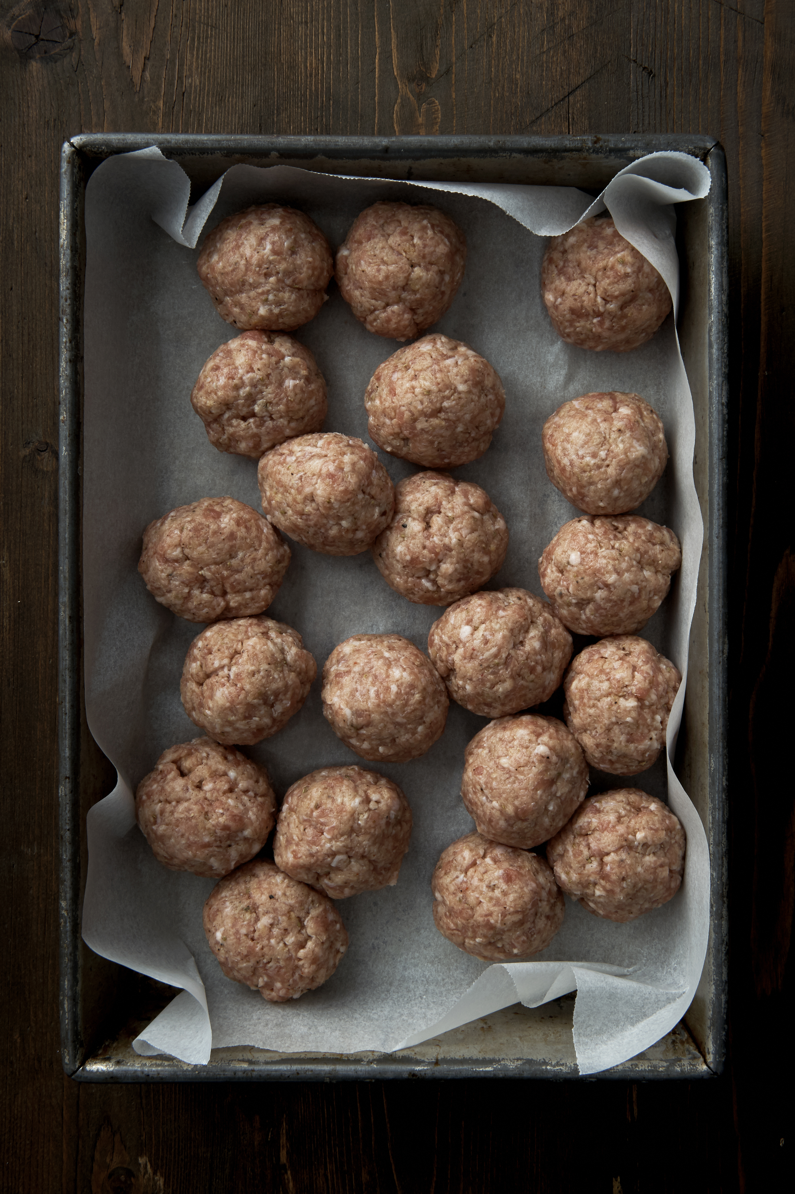 Spicy pork and fennel meatballs in onion sauce