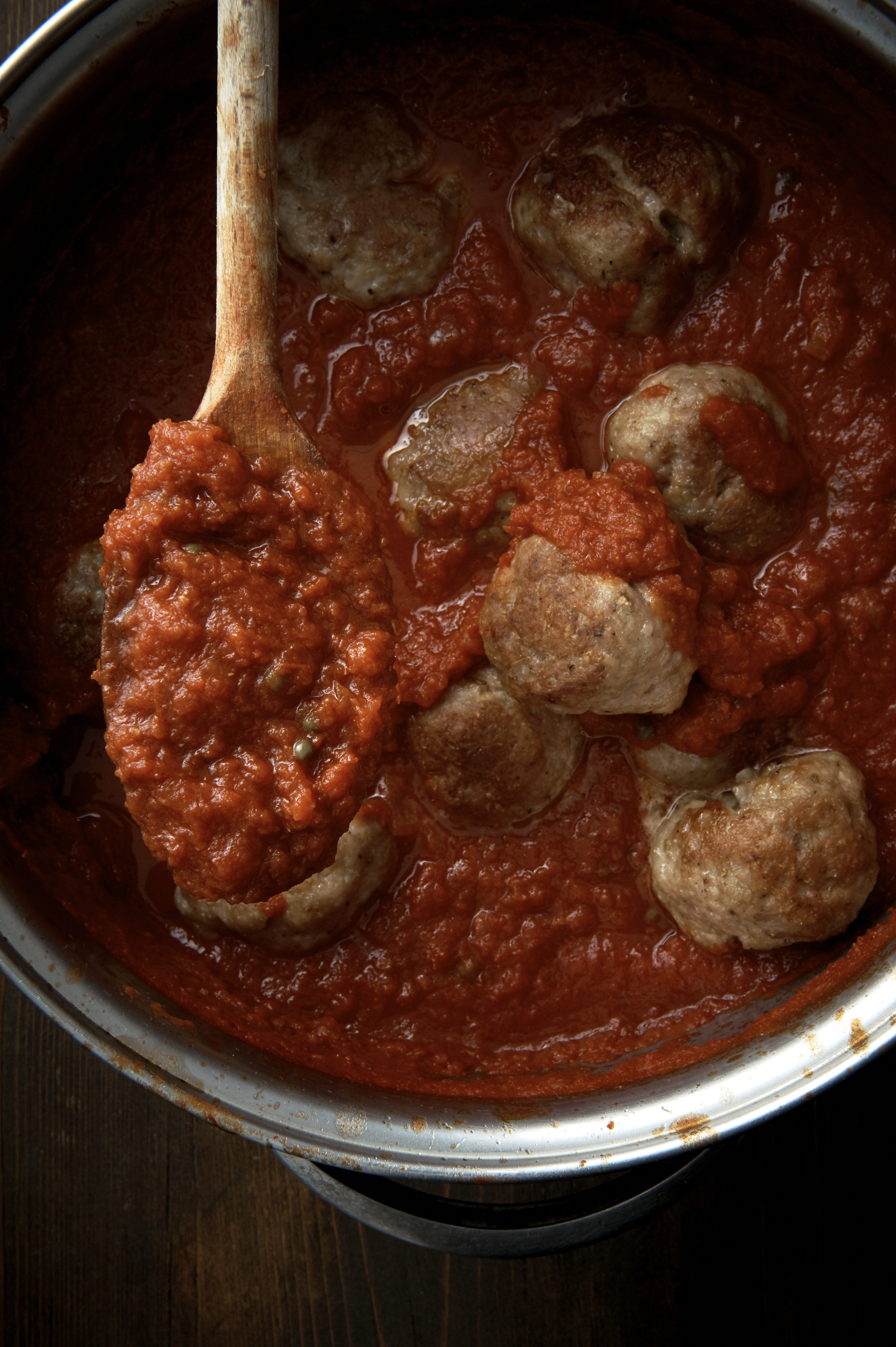 Spicy pork and fennel meatballs in onion sauce