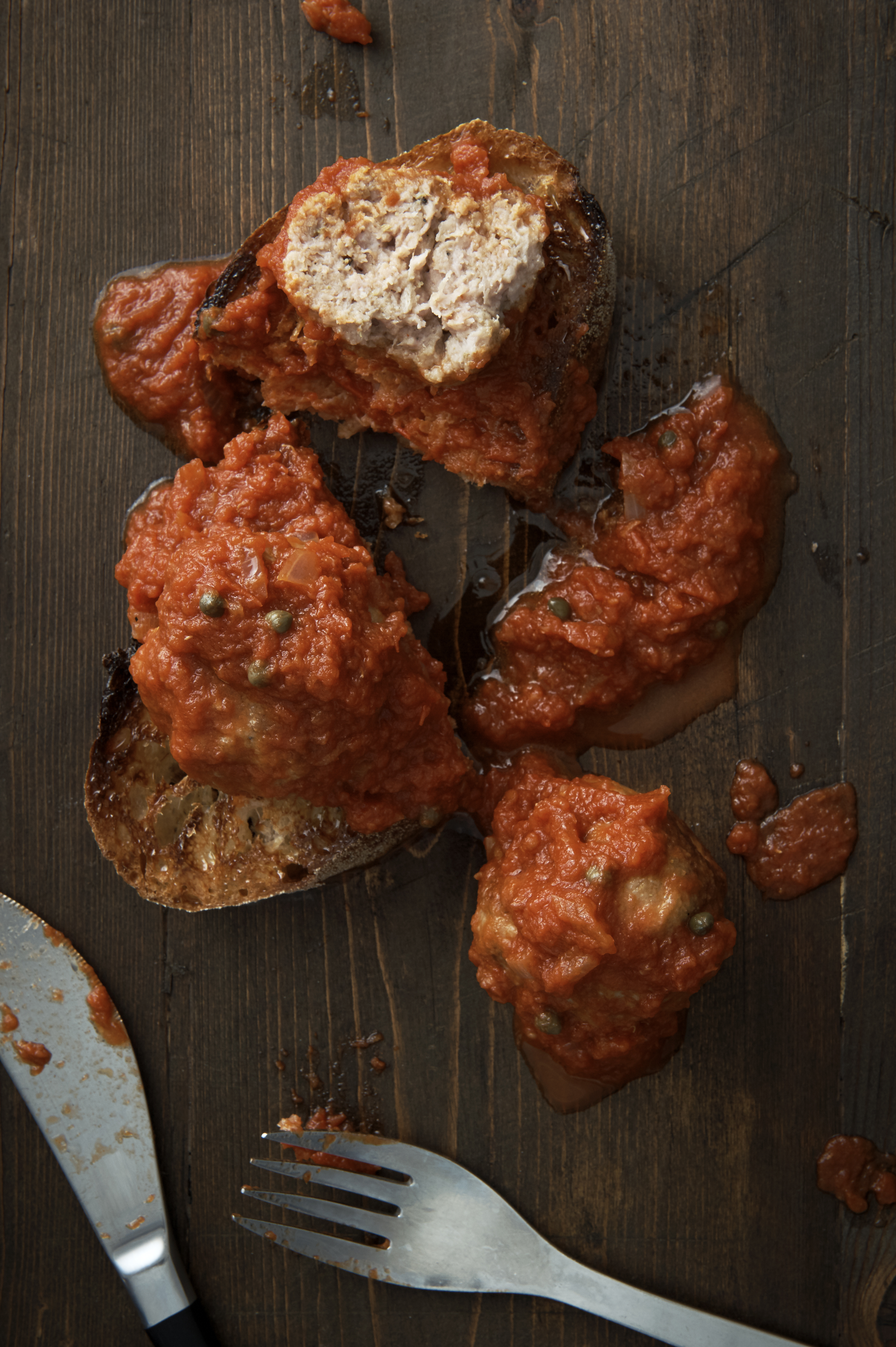 Spicy pork and fennel meatballs in onion sauce