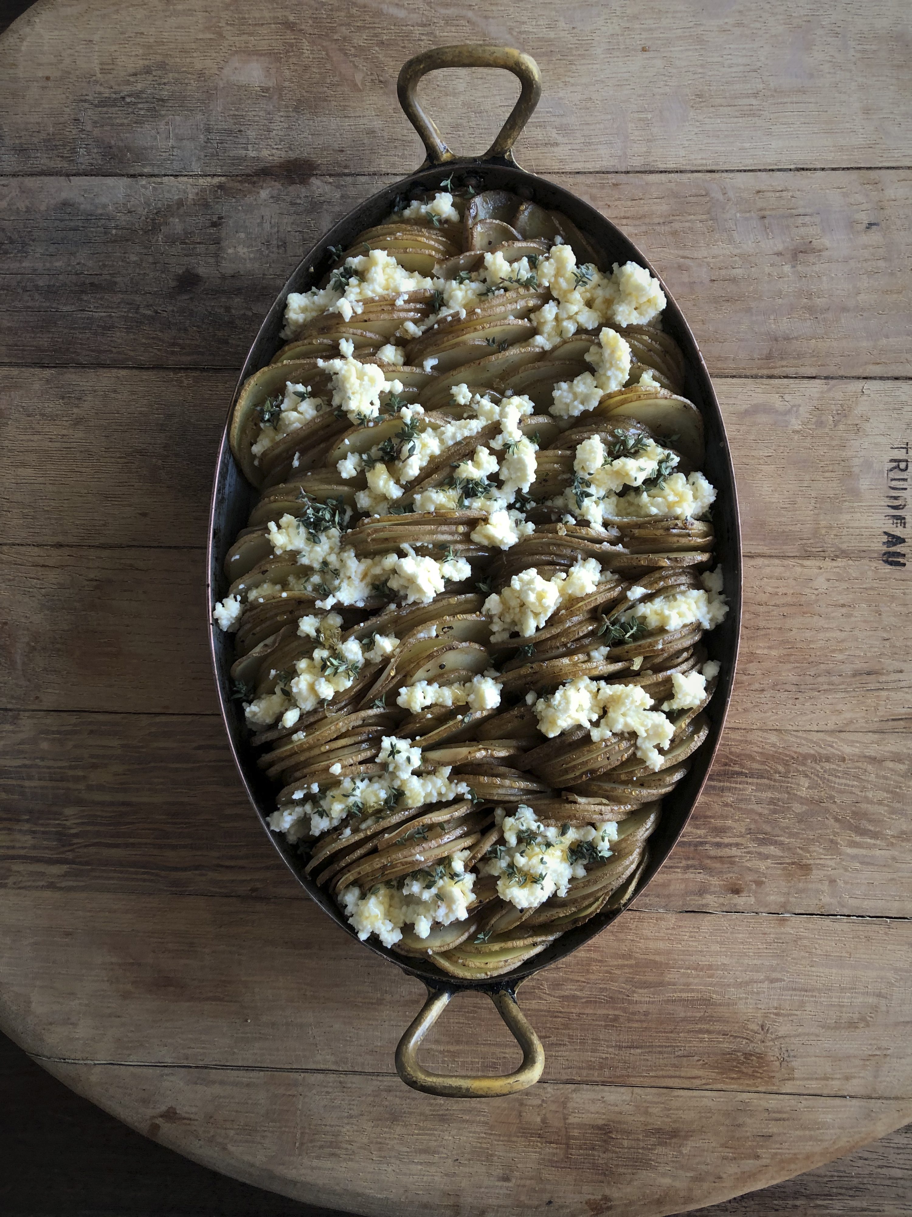 Potato gratin with ricotta, honey and thyme