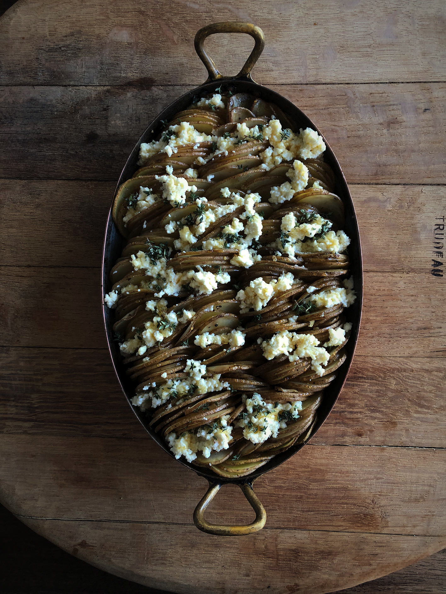 Potato gratin with ricotta, honey and thyme