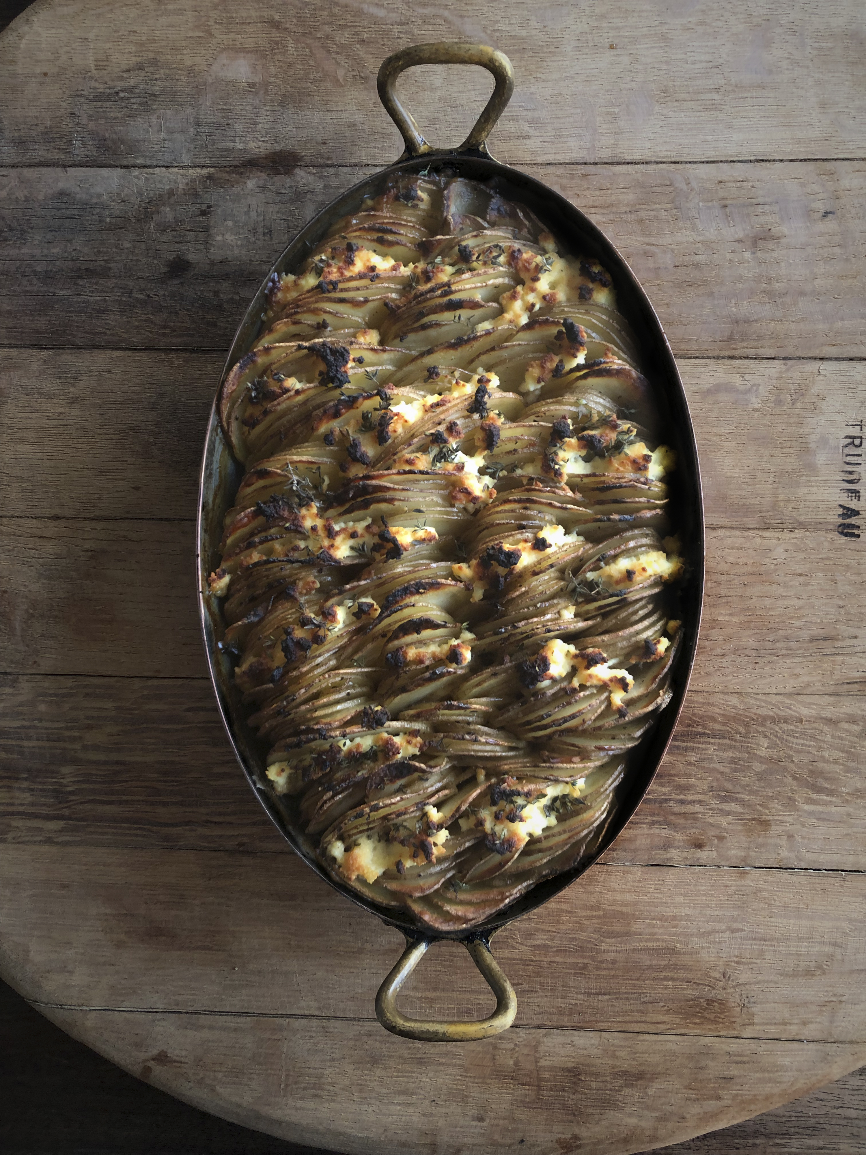 Potato gratin with ricotta, honey and thyme