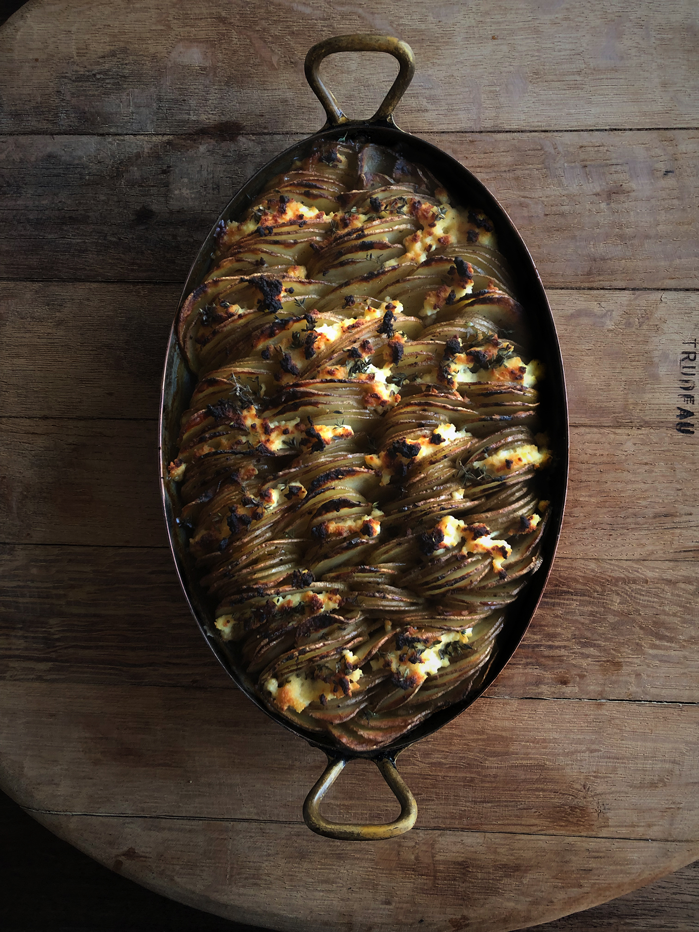 Potato gratin with ricotta, honey and thyme