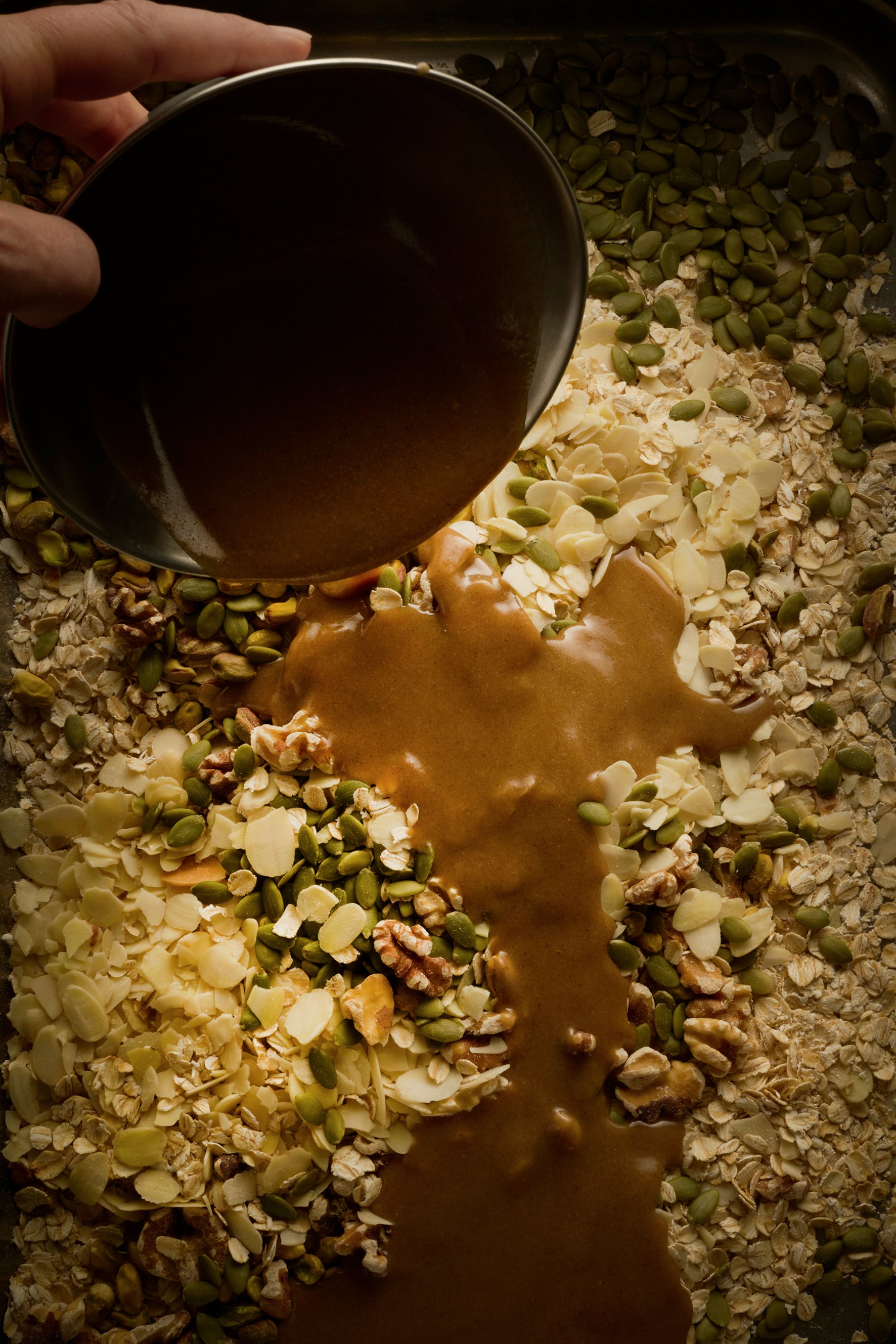 Tahini and maple syrup roasted granola with poached pears and vanilla yoghurt