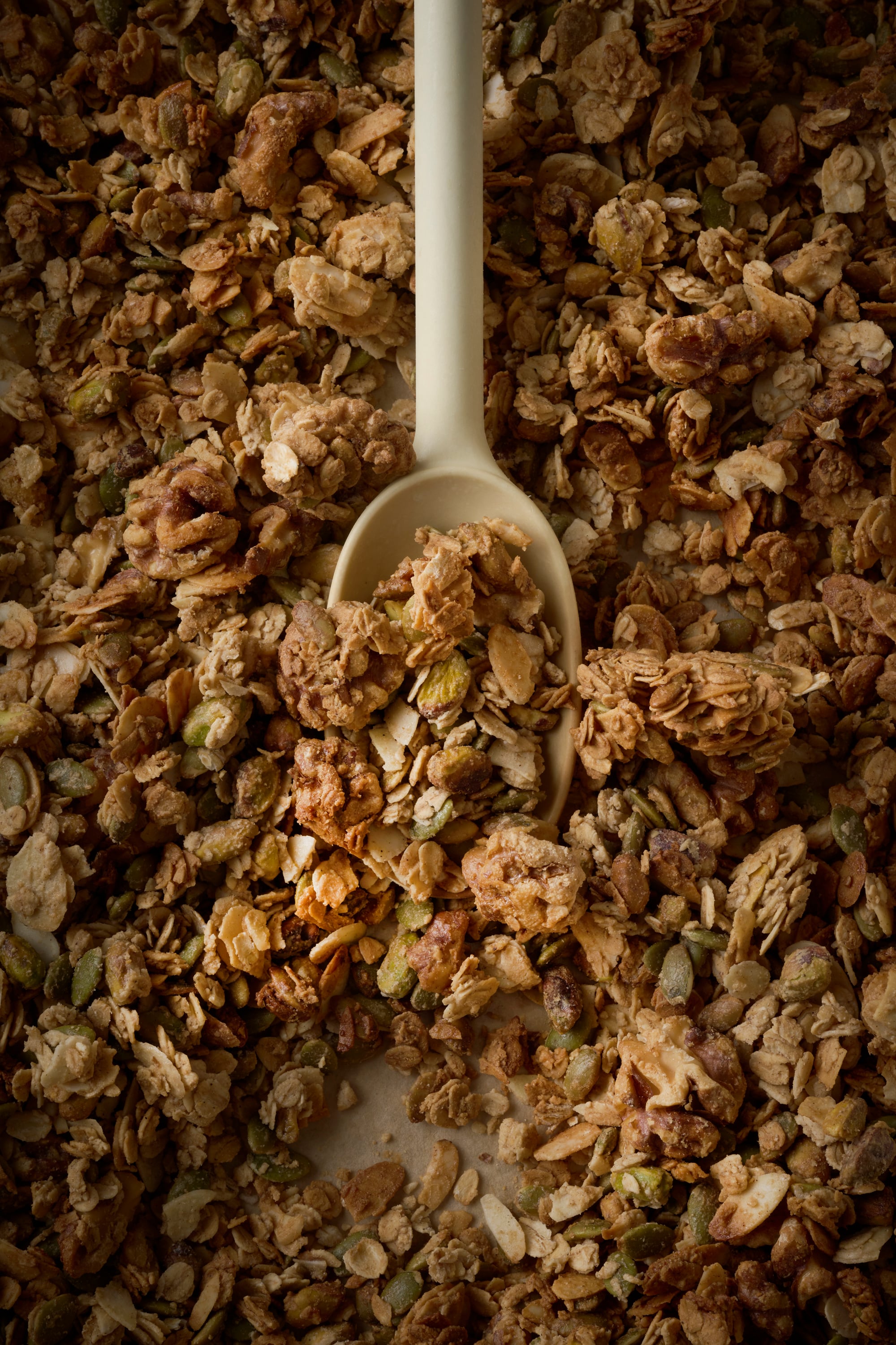Tahini and maple syrup roasted granola with poached pears and vanilla yoghurt