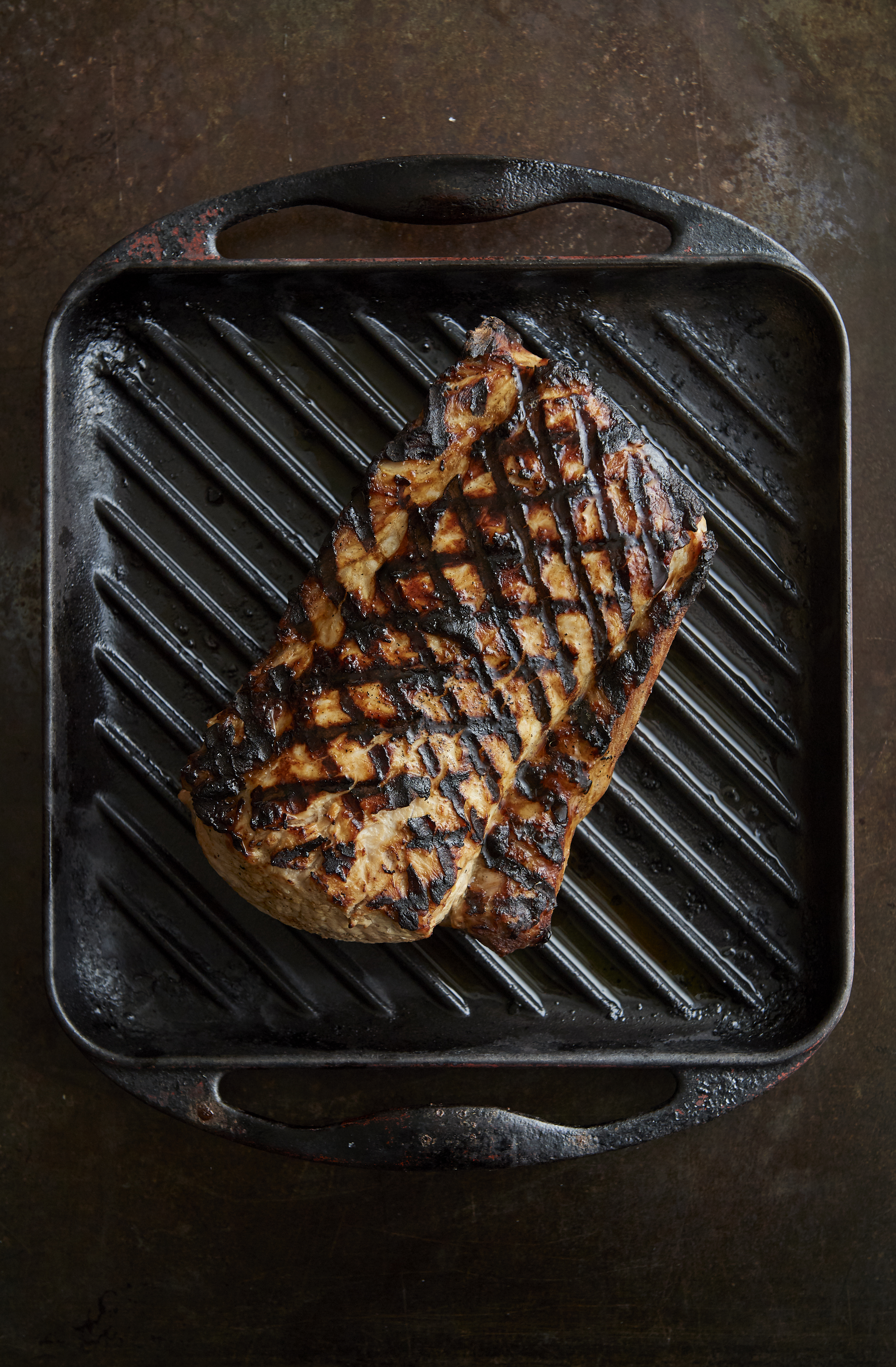 Barbecued brined pork loin with potato salad and grilled zucchini