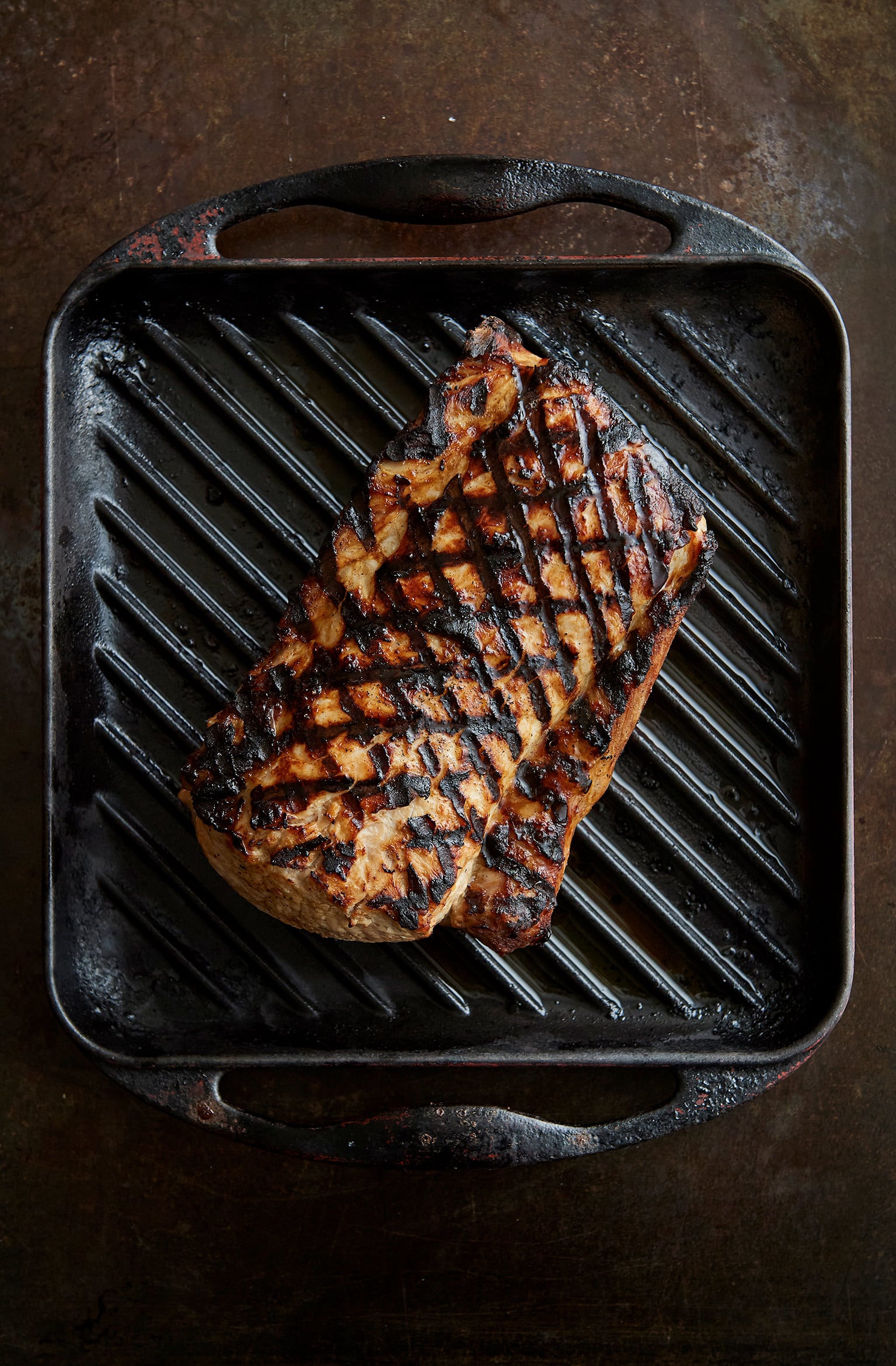 Barbecued brined pork loin with potato salad and grilled zucchini