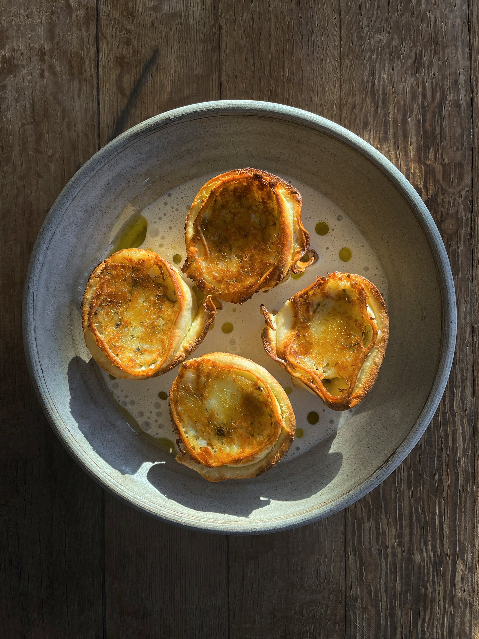 Potato and garlic rotolo with anchovy sauce