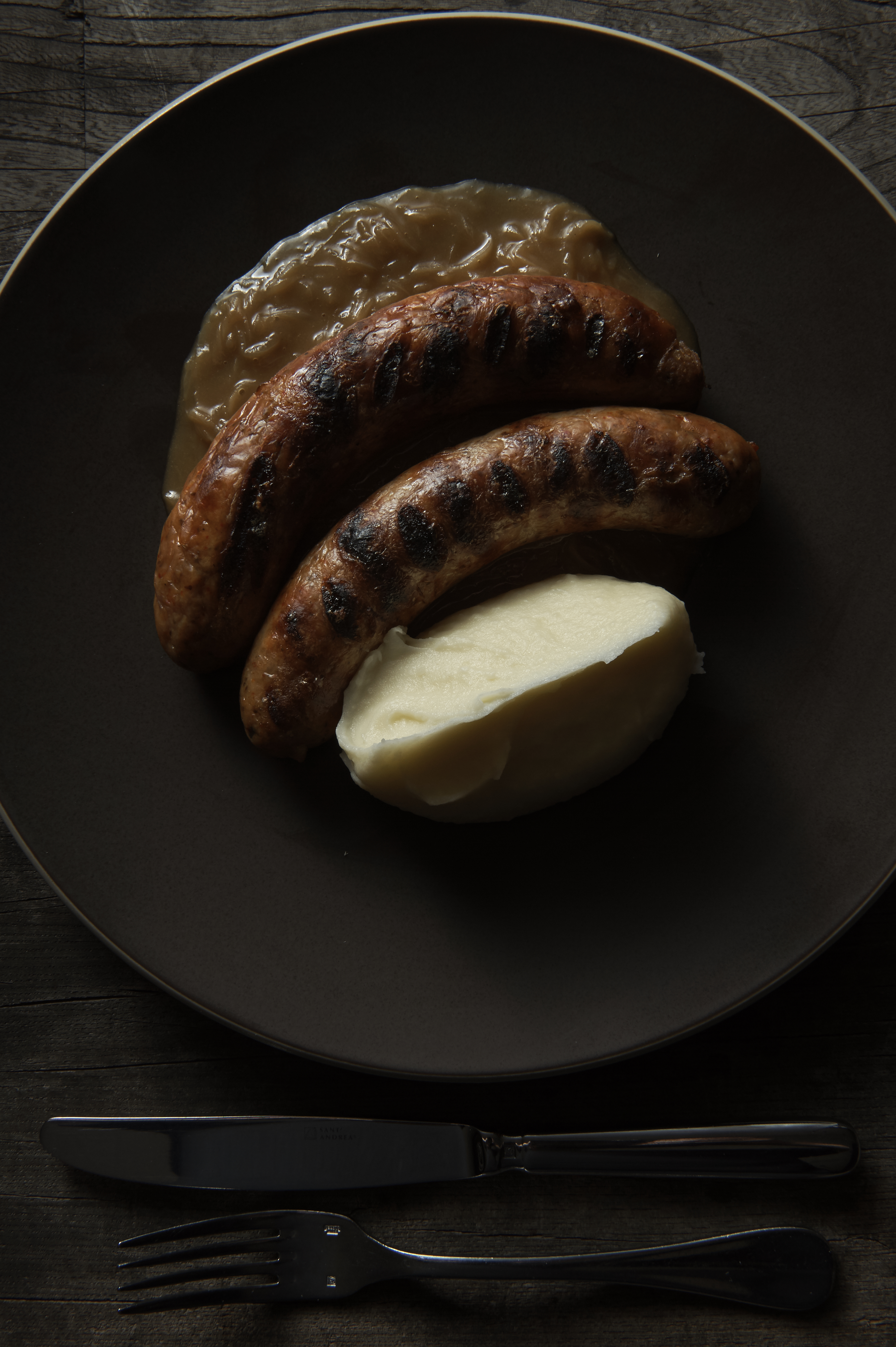 Pork and fennel sausages, onion gravy and mash