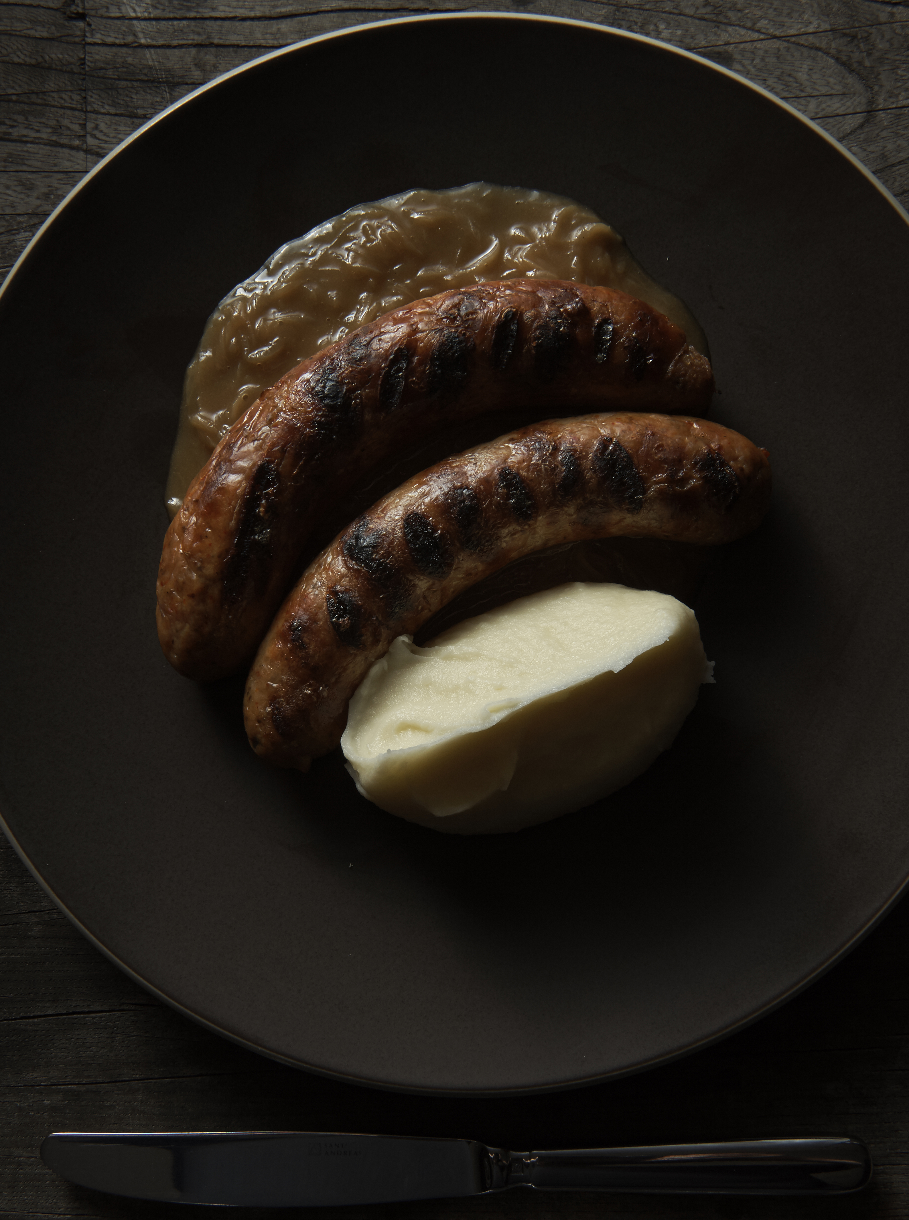 Pork and fennel sausages, onion gravy and mash