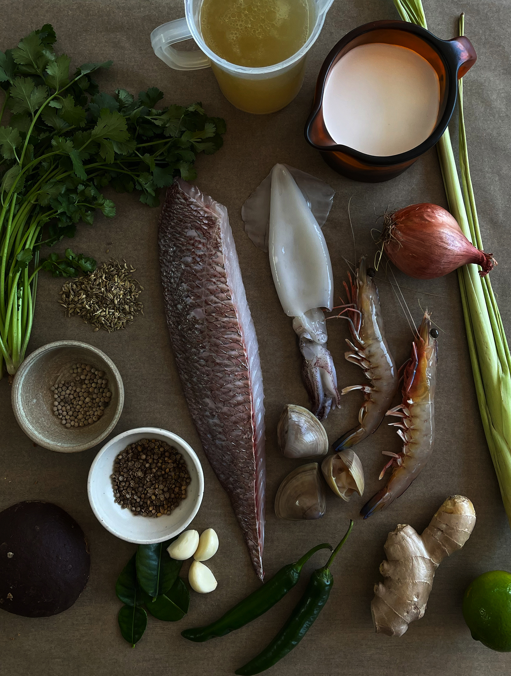 Seafood broth  with green chilli, coconut and lime