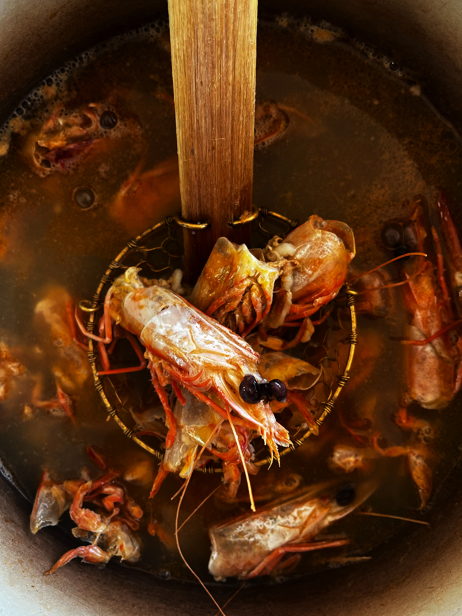 Seafood broth  with green chilli, coconut and lime