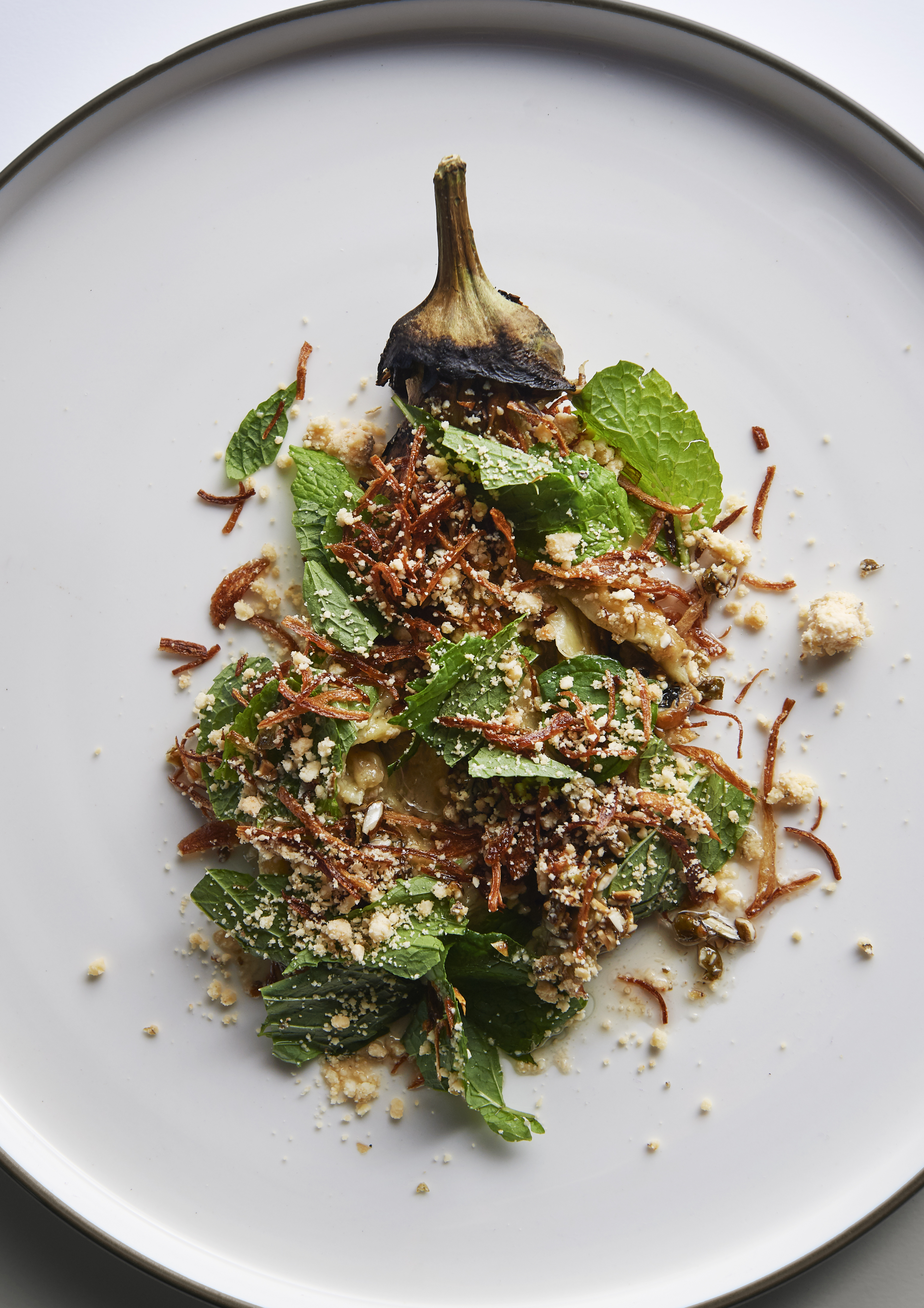 Smoked eggplant with salted cheese and mint