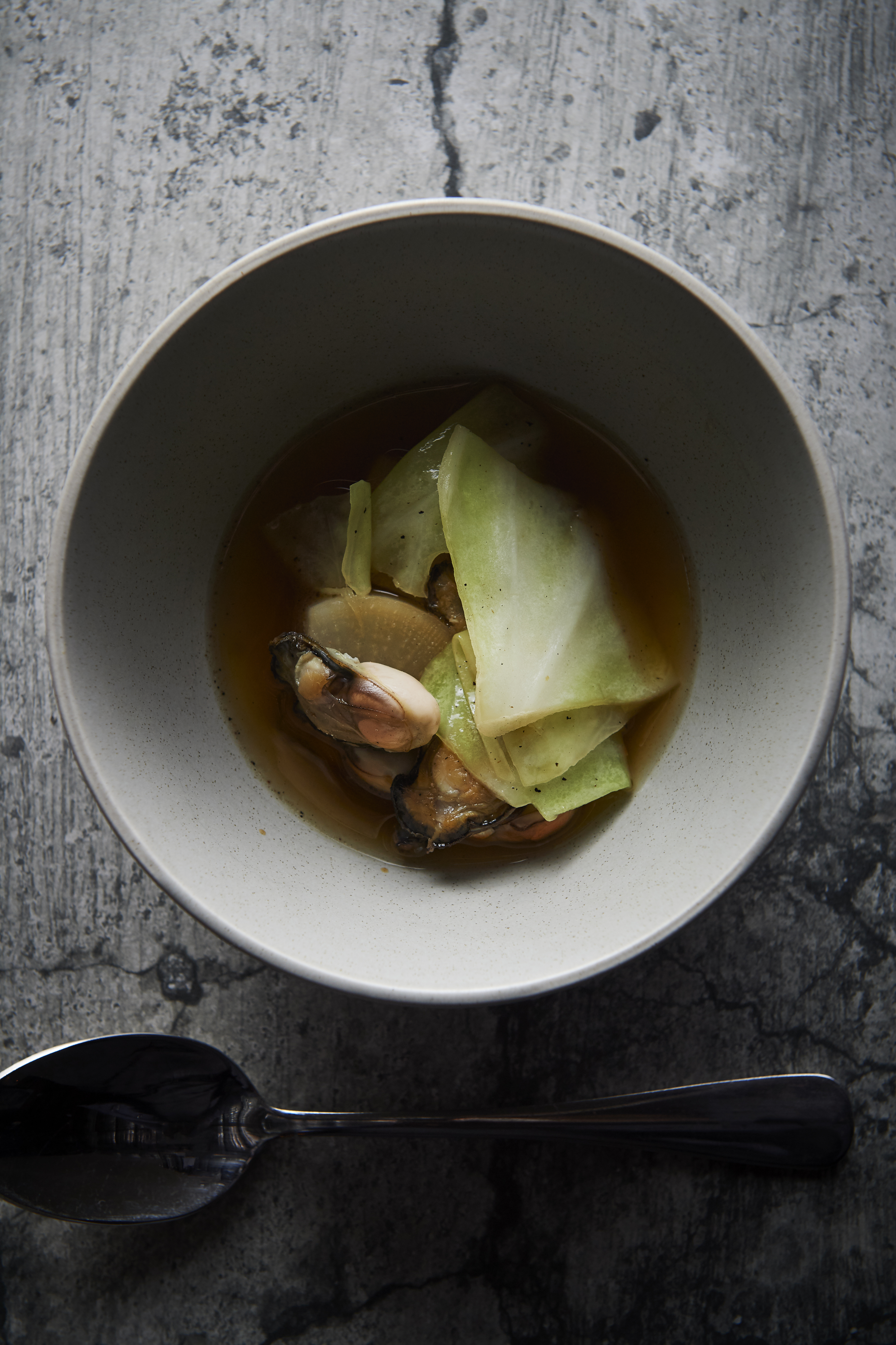 Smoked oysters and chicken broth