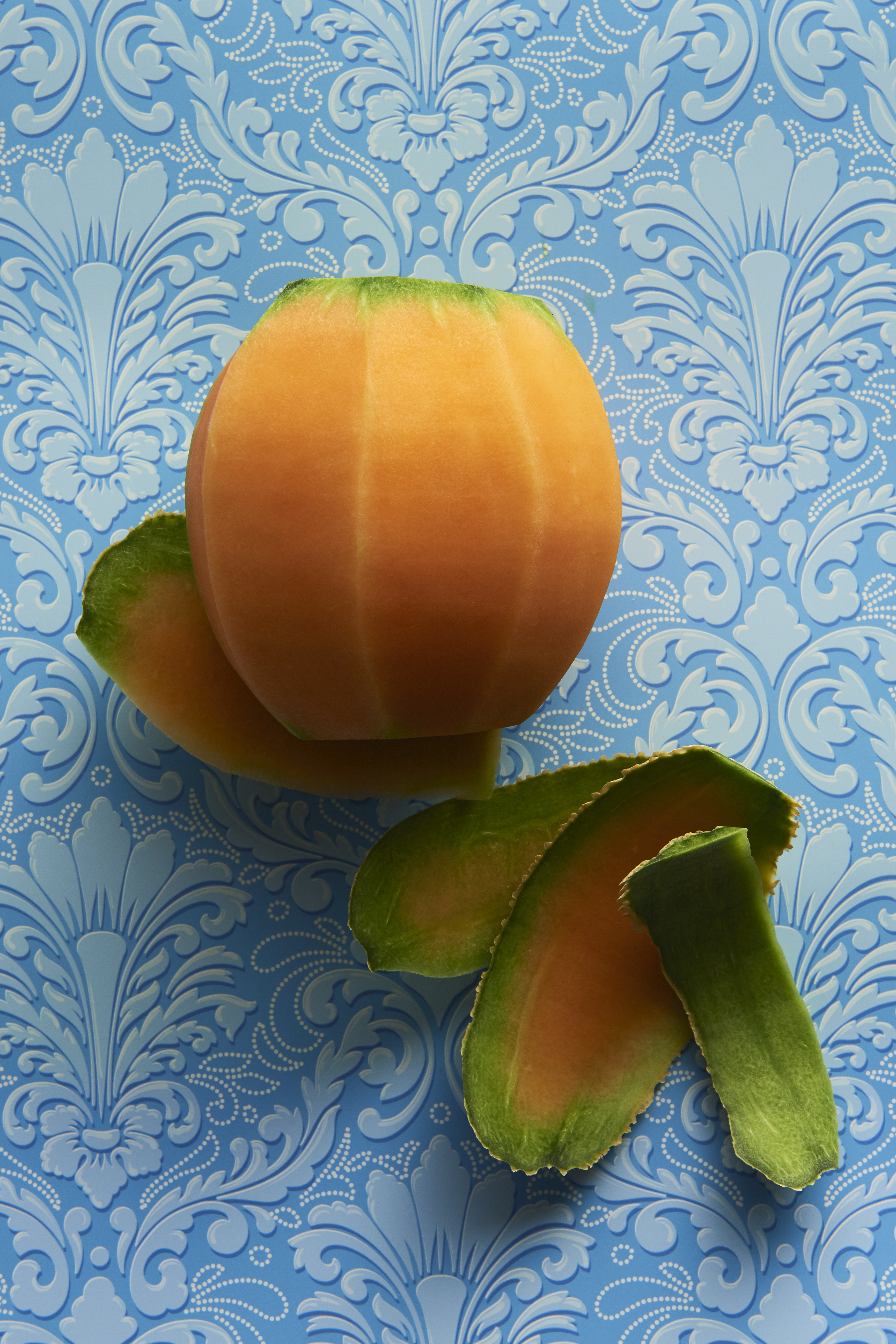 Grilled rockmelon with turmeric, fetta and mint